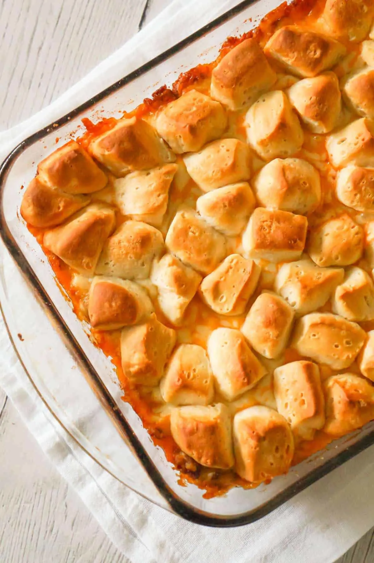 Sloppy Joe Biscuit Casserole is an easy ground beef casserole recipe loaded with French's fried onions, shredded mozzarella, cheddar and topped with Pillsbury biscuit pieces.