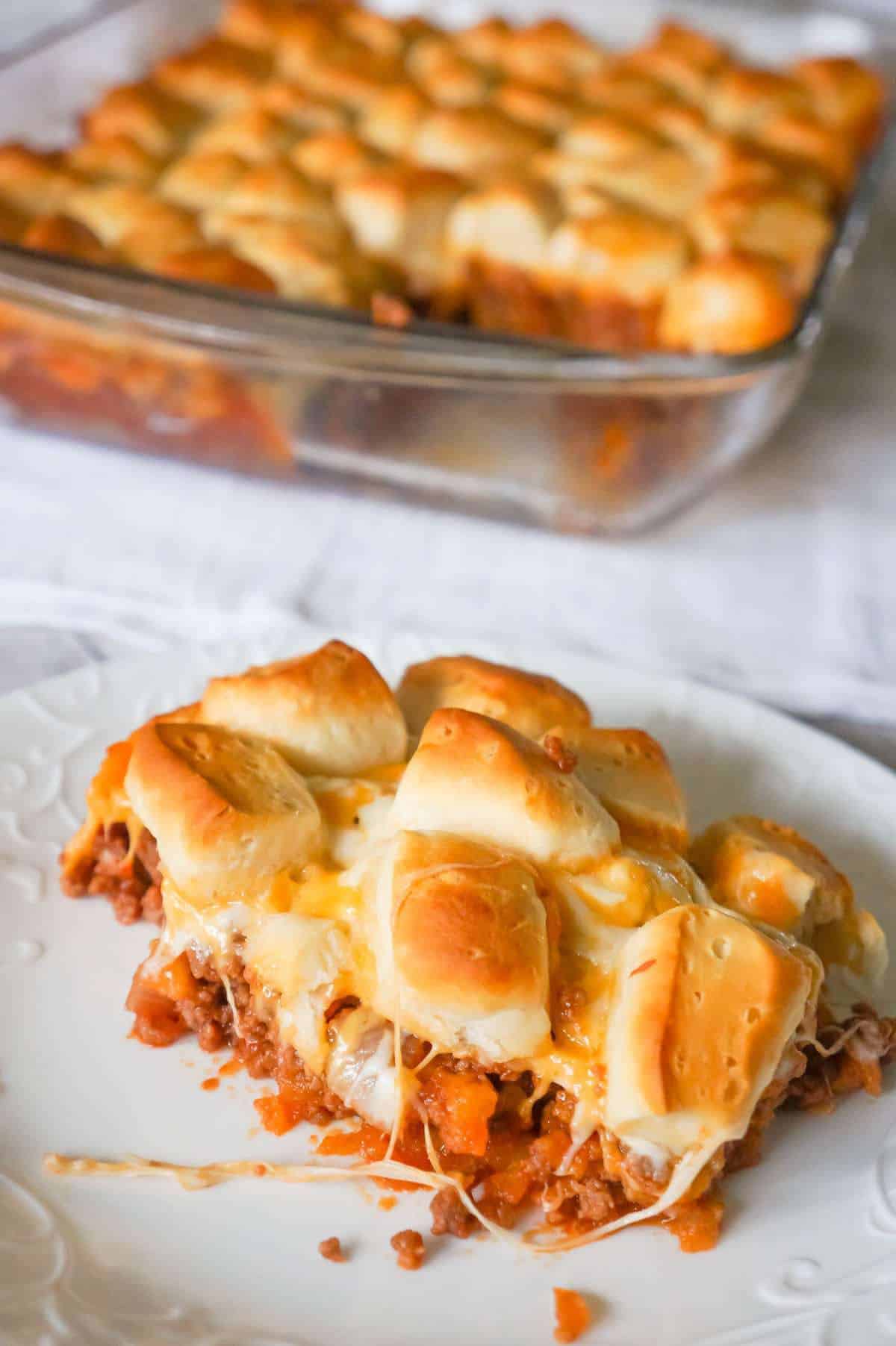 Sloppy Joe Biscuit Casserole is an easy ground beef casserole recipe loaded with French's fried onions, shredded mozzarella, cheddar and topped with Pillsbury biscuit pieces.