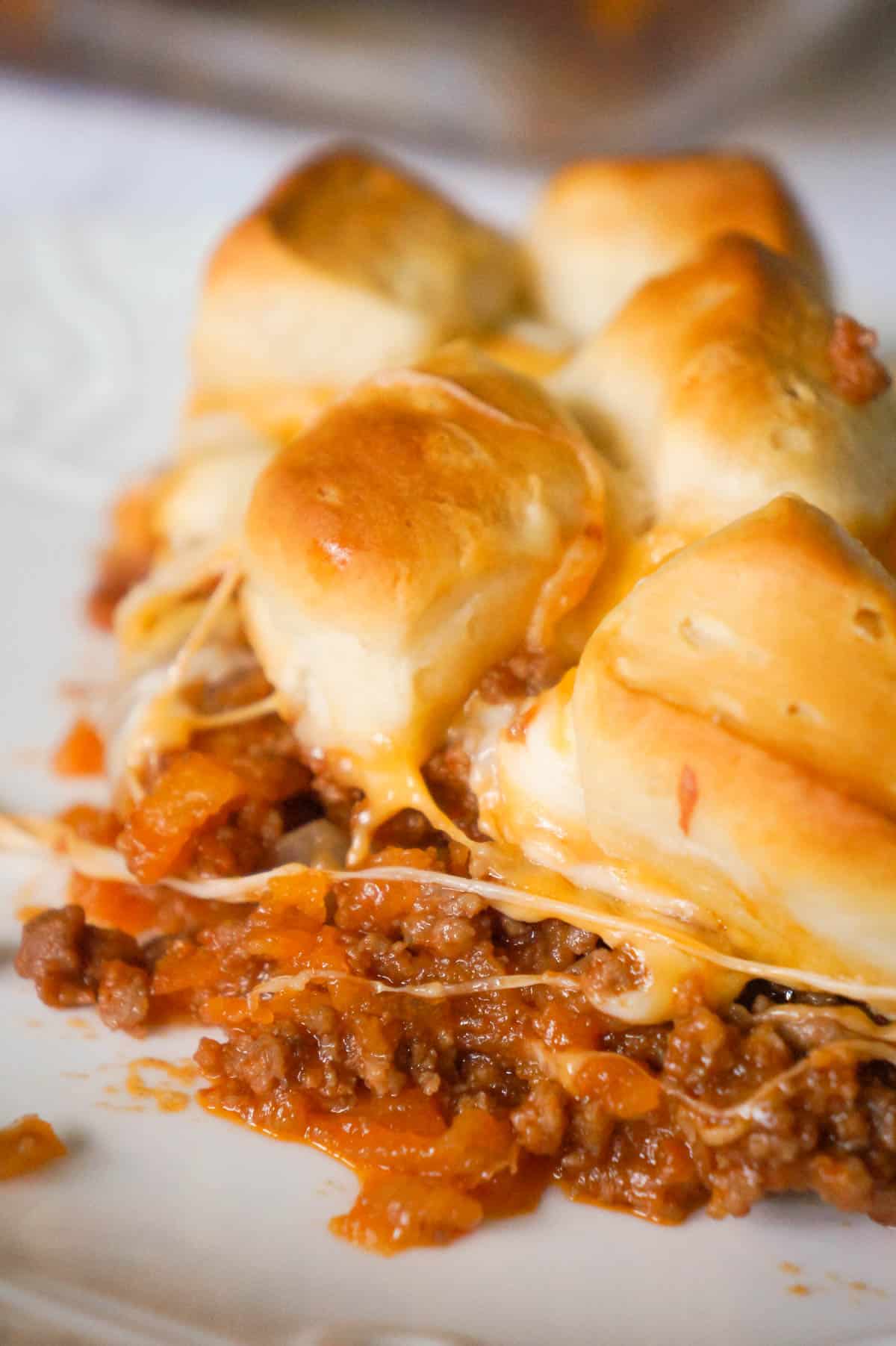 Sloppy Joe Biscuit Casserole is an easy ground beef casserole recipe loaded with French's fried onions, shredded mozzarella, cheddar and topped with Pillsbury biscuit pieces.