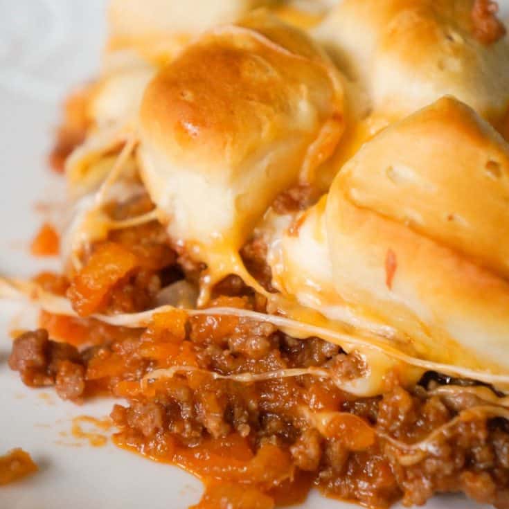 Sloppy Joe Biscuit Casserole is an easy ground beef casserole recipe loaded with French's fried onions, shredded mozzarella, cheddar and topped with Pillsbury biscuit pieces.