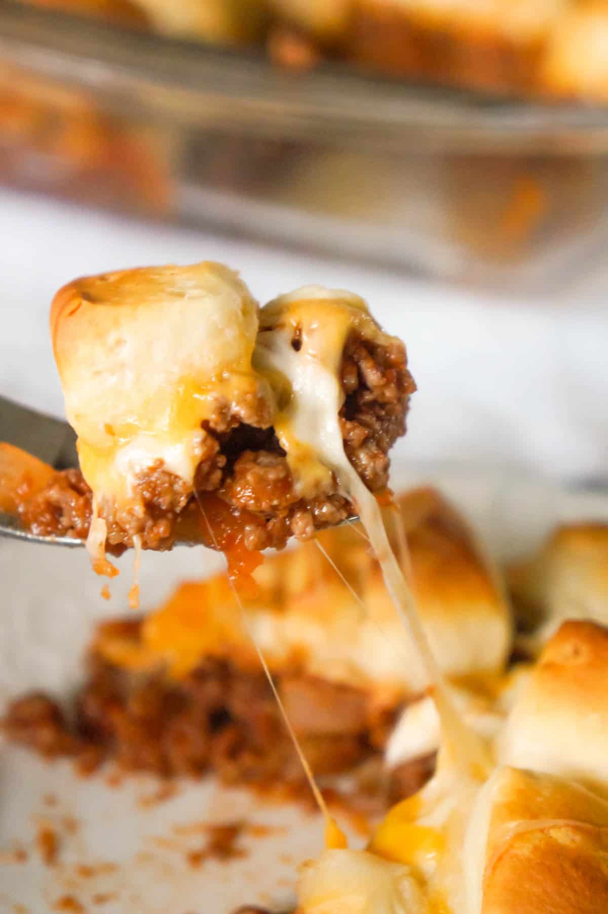 Sloppy Joe Biscuit Casserole is an easy ground beef casserole recipe loaded with French's fried onions, shredded mozzarella, cheddar and topped with Pillsbury biscuit pieces.