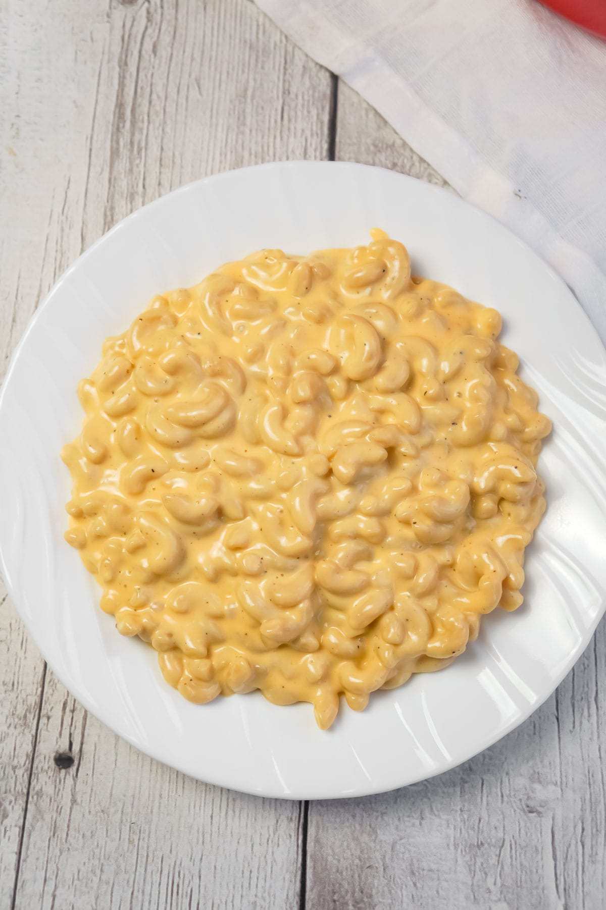 Creamy Stovetop Mac and Cheese is an easy and delicious homemade macaroni and cheese recipe made with cheddar cheese soup, heavy cream, mozzarella and cheddar cheese.