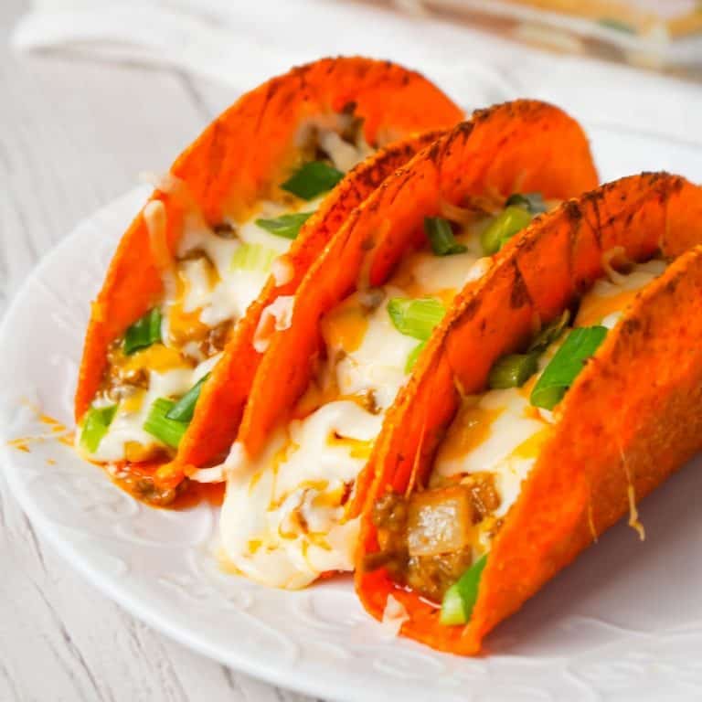 Extra Cheesy Baked Beef Tacos are an easy weeknight dinner recipe using ground beef, salsa con queso cheese dip, shredded mozzarella and cheddar and nacho cheese flavoured stand and stuff taco shells.