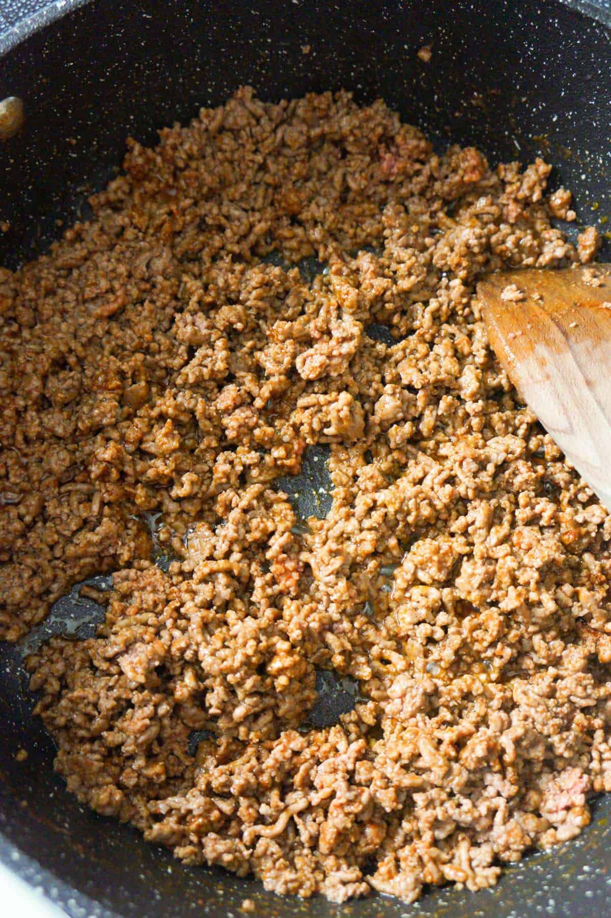 ground beef coated in taco seasoning in a saute pan