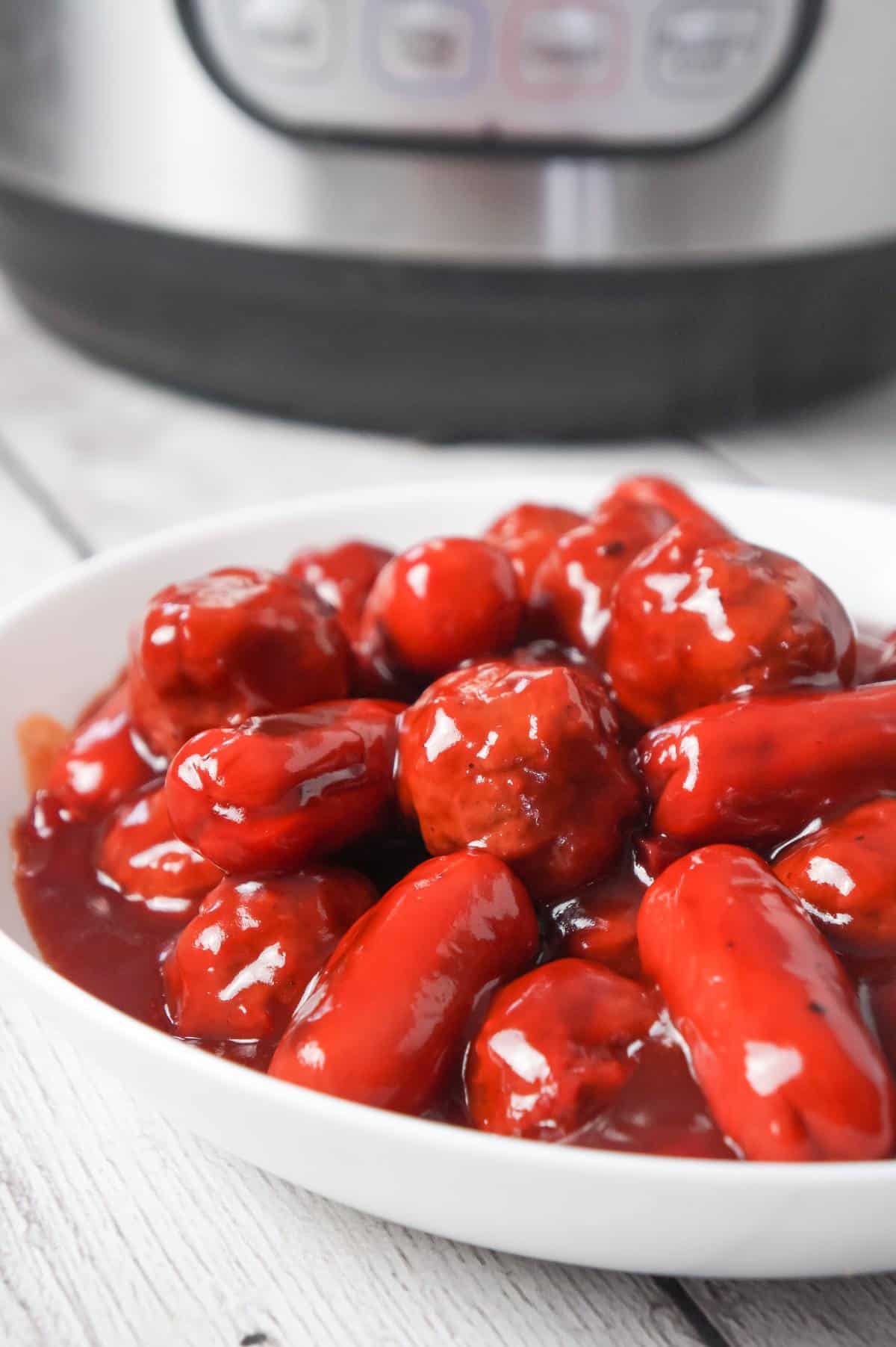 Instant Pot Cherry BBQ Meatballs and Cocktail Wieners are a delicous party snack made with cherry pie filling, Sweet Baby Ray's BBQ sauce and Thai sweet chili sauce.