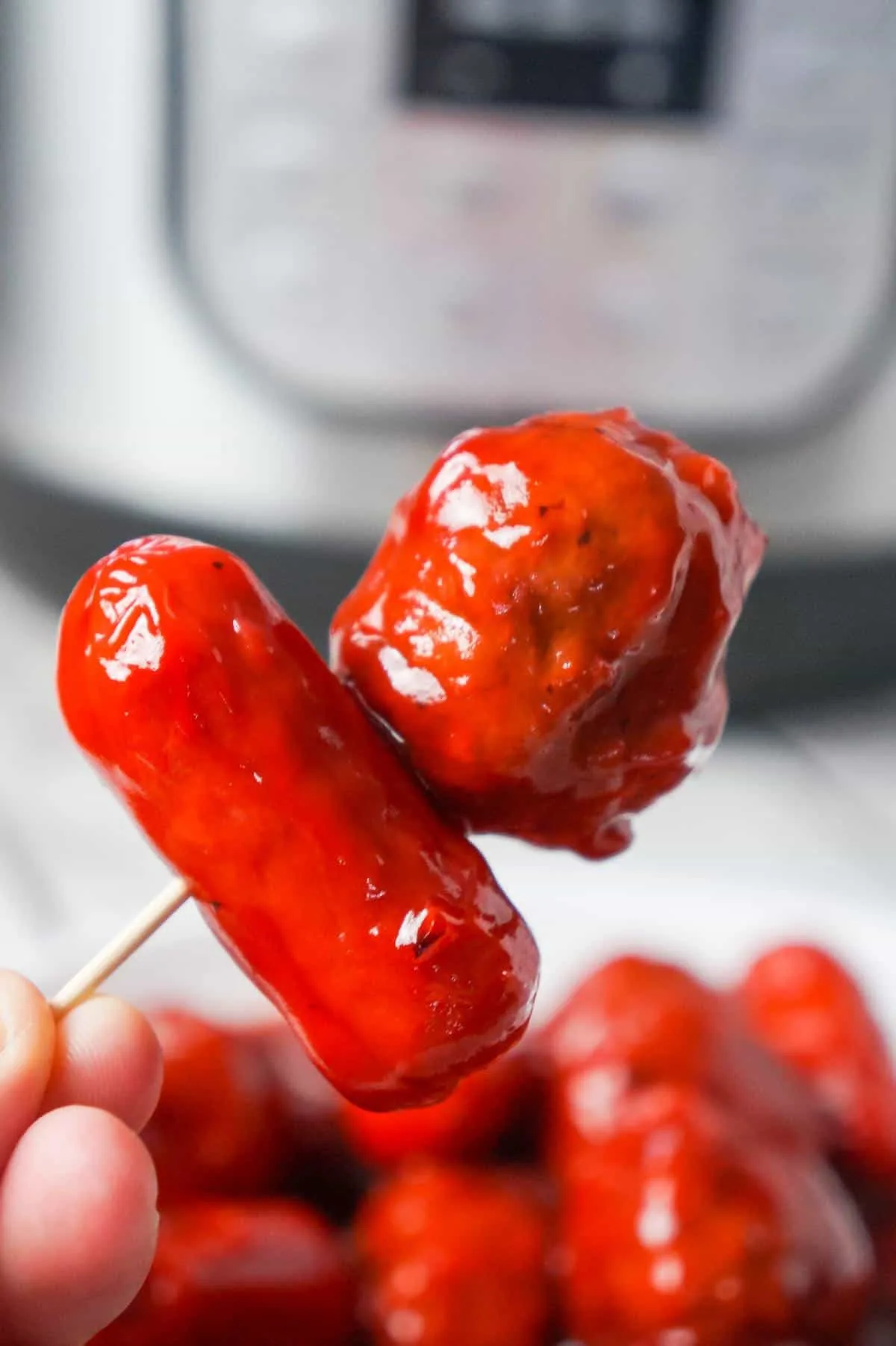 Instant Pot Cherry BBQ Meatballs and Cocktail Wieners are a delicous party snack made with cherry pie filling, Sweet Baby Ray's BBQ sauce and Thai sweet chili sauce.