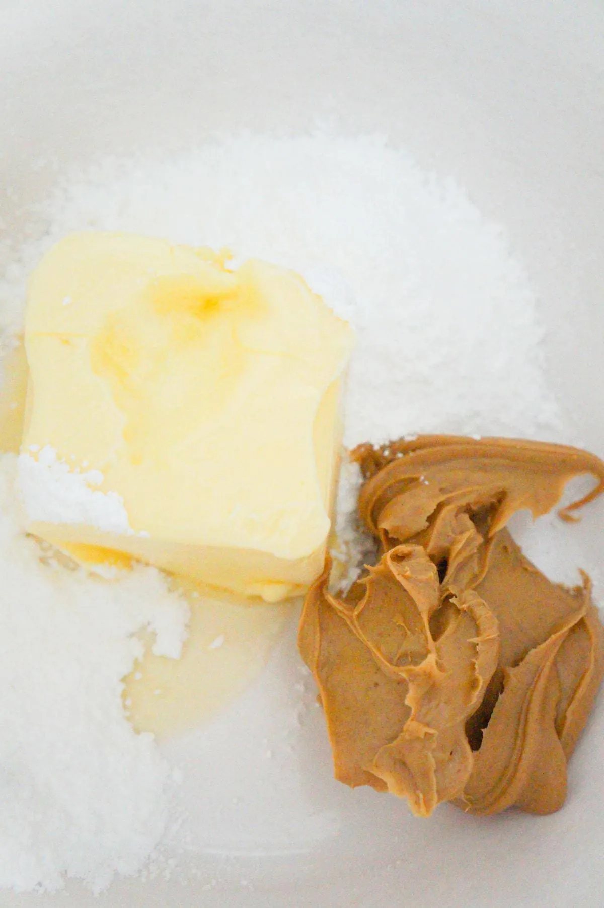 softened butter, smooth peanut butter and confectioner's sugar in a mixing bowl