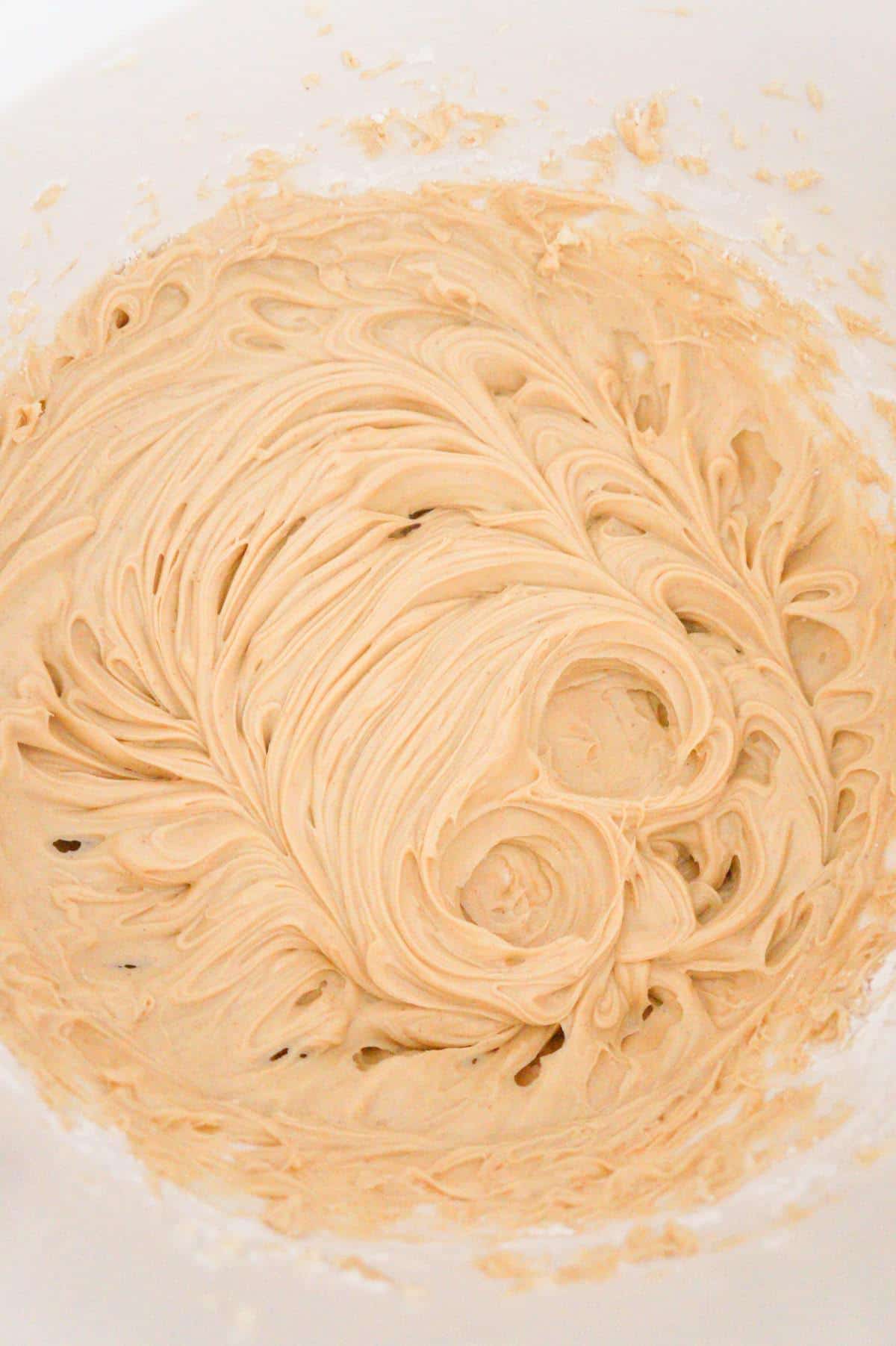 creamy butter and peanut butter mixture in a mixing bowl