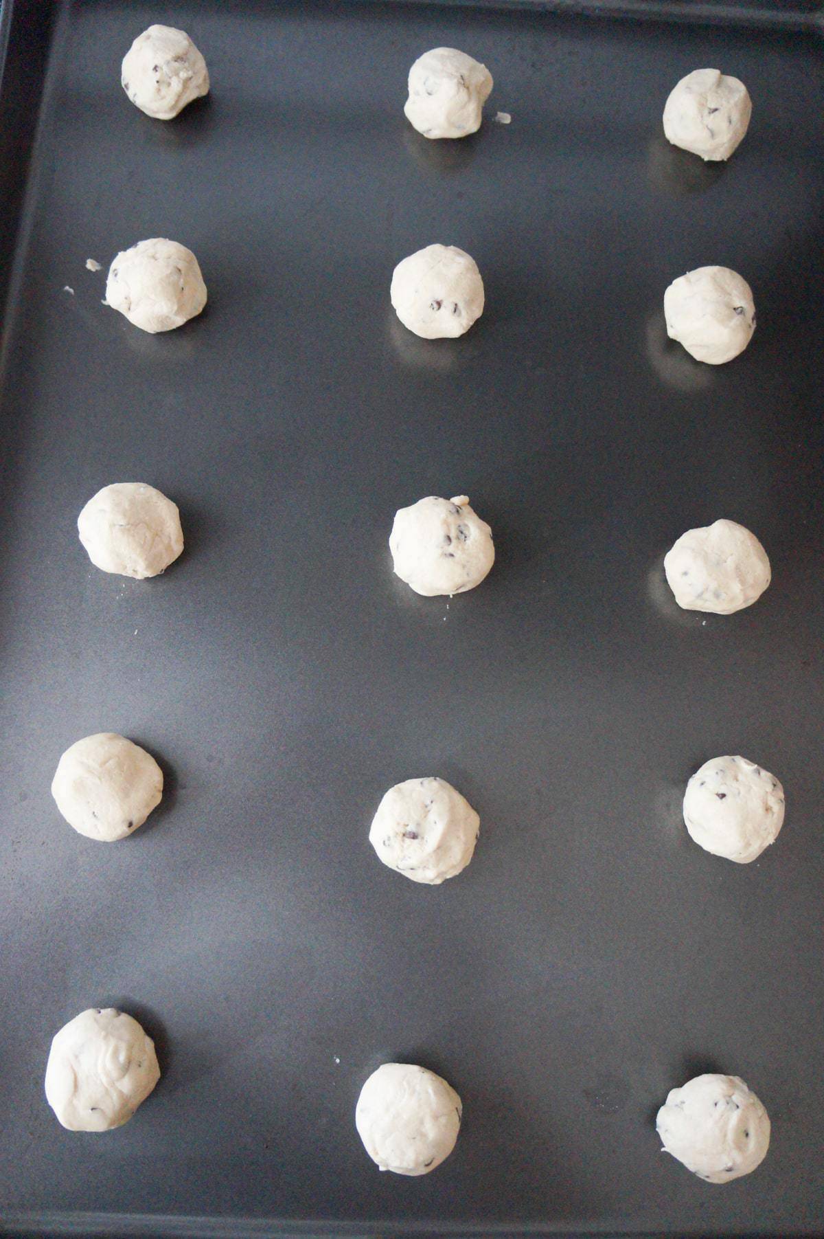 shortbread cookie dough balls on a baking sheet