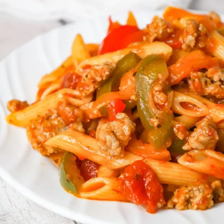 Sausage and Peppers Pasta is a delicious dinner recipe using penne pasta and loaded with sliced bell peppers, onions and Italian sausage meat.