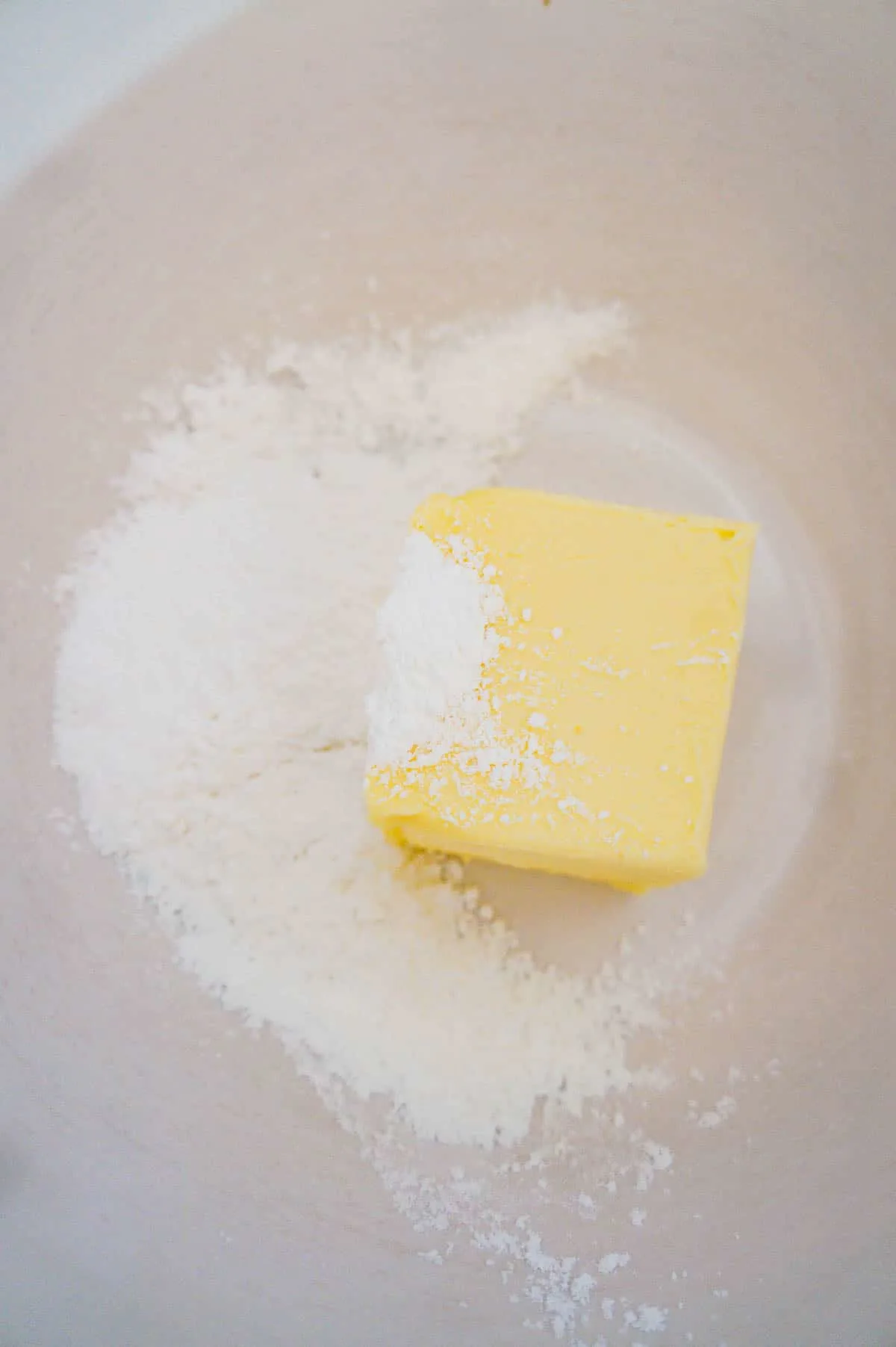 icing sugar and softened butter in a large mixing bowl
