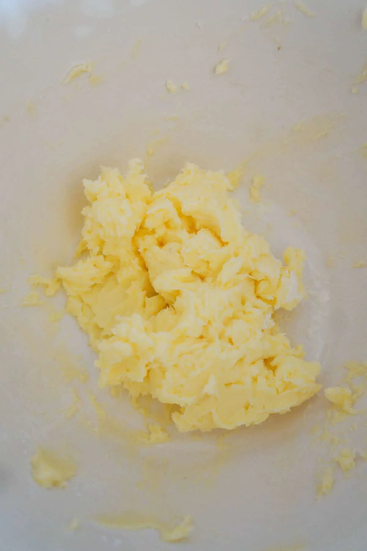 creamed butter and icing sugar mixture in a mixing bowl