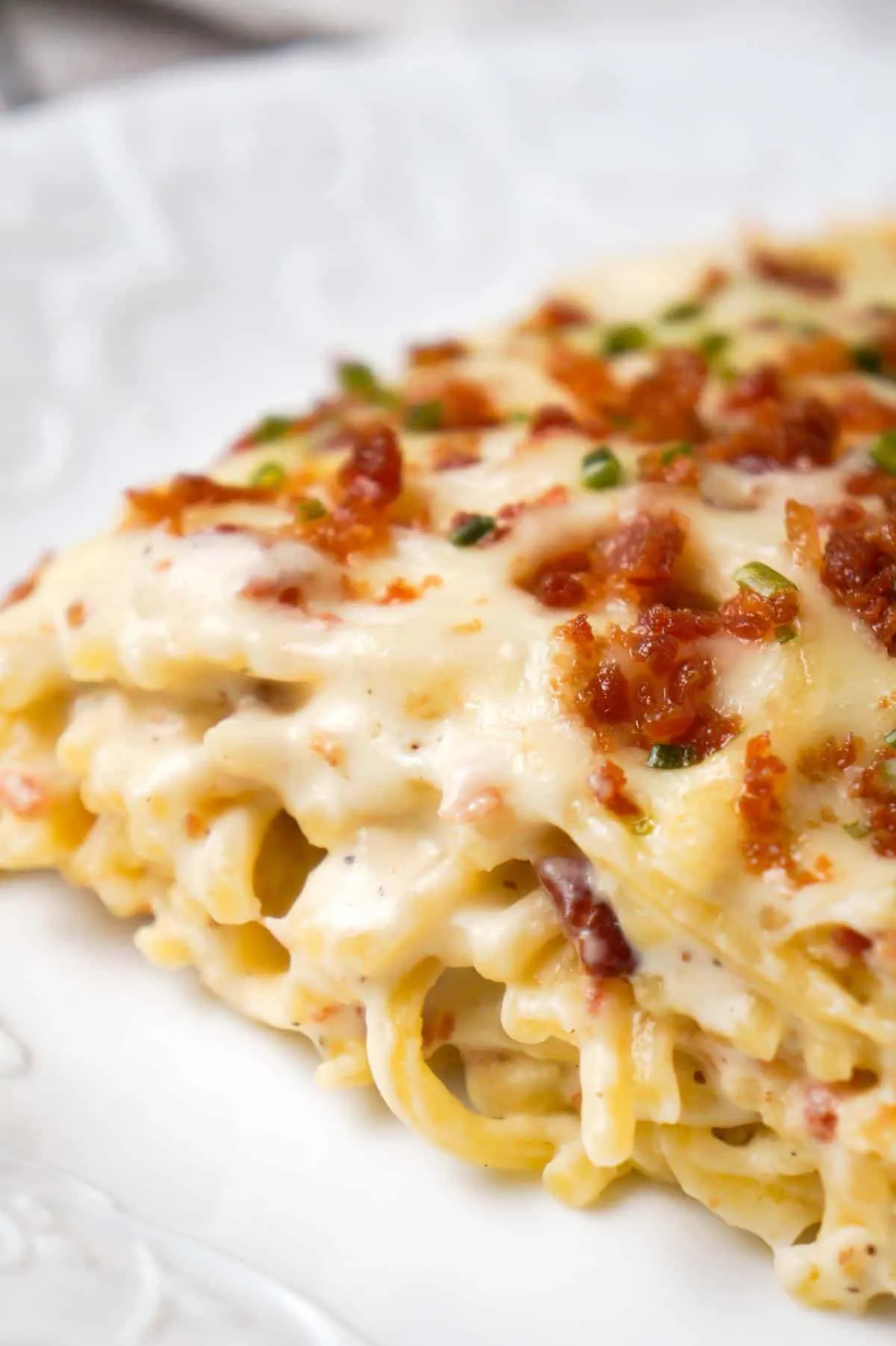 Bacon Cream Cheese Baked Spaghetti is a delicious pasta recipe loaded with crumbled bacon, Philadelphia Whipped Chive cream cheese and mozzarella cheese.