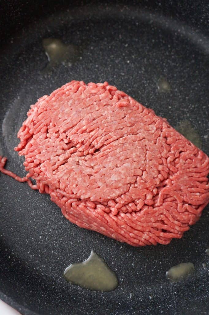 raw ground beef in a pan