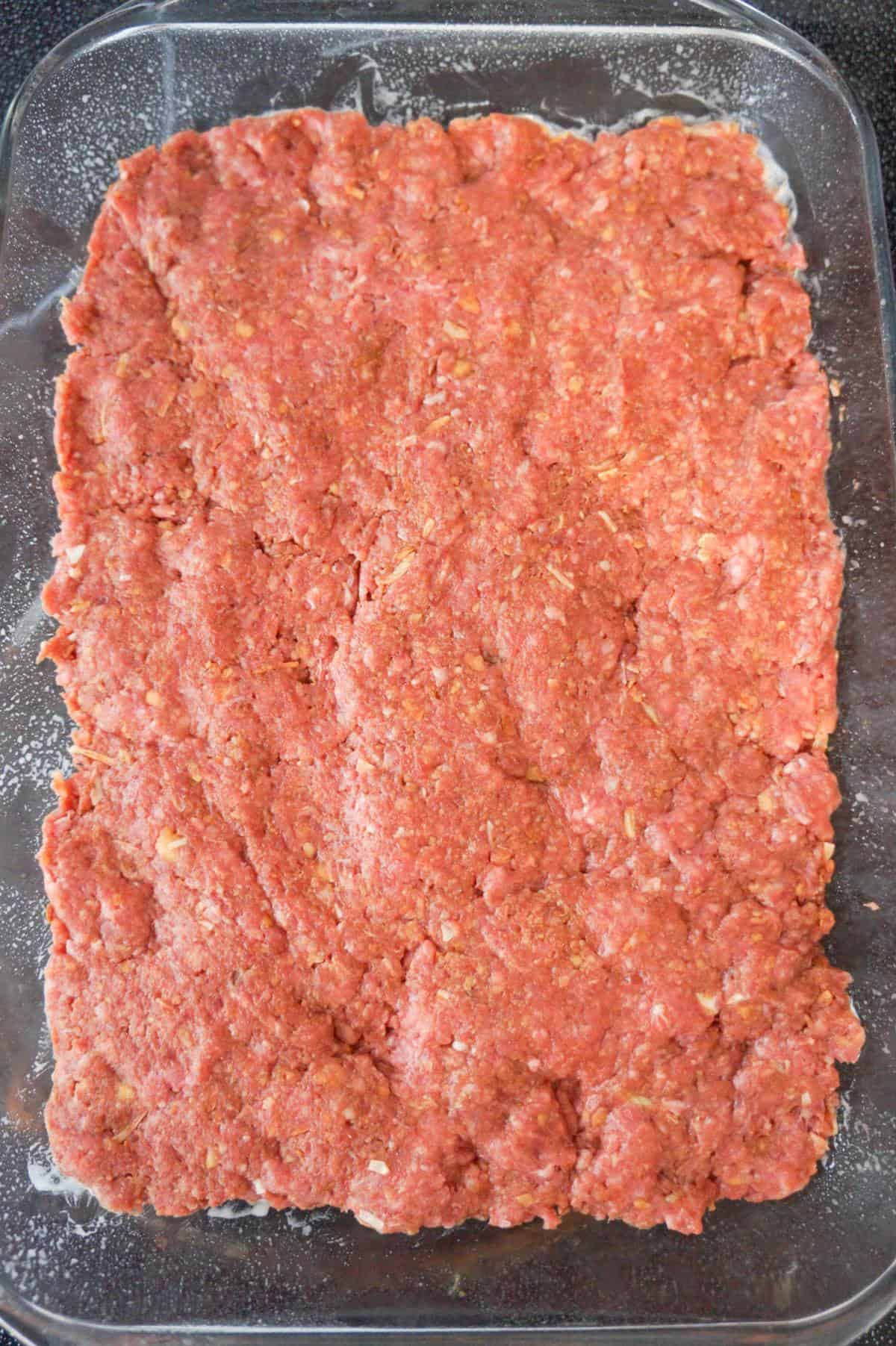 raw meatloaf mixture in a baking dish