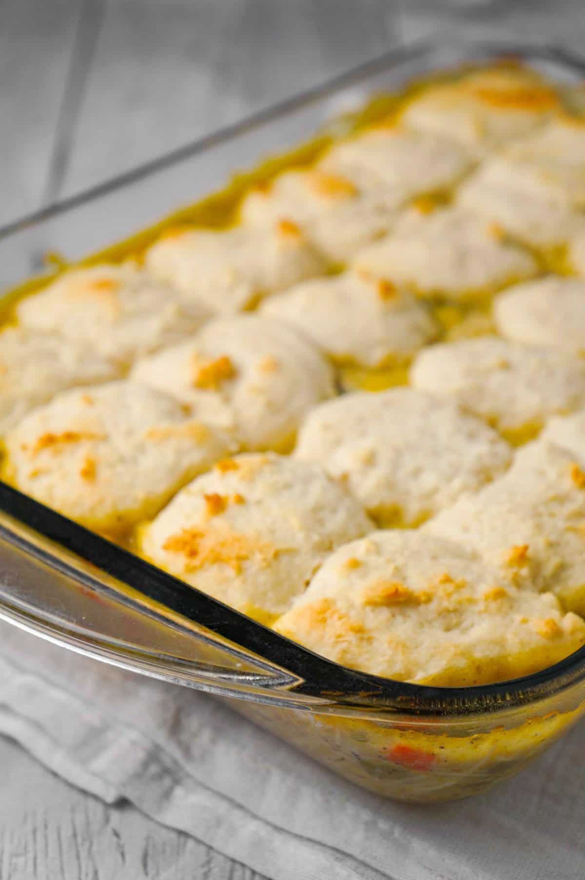 Chicken and Dumplings Casserole is an easy dinner recipe using shredded rotisserie chicken, cream of chicken soup, canned veggies and Bisquick.