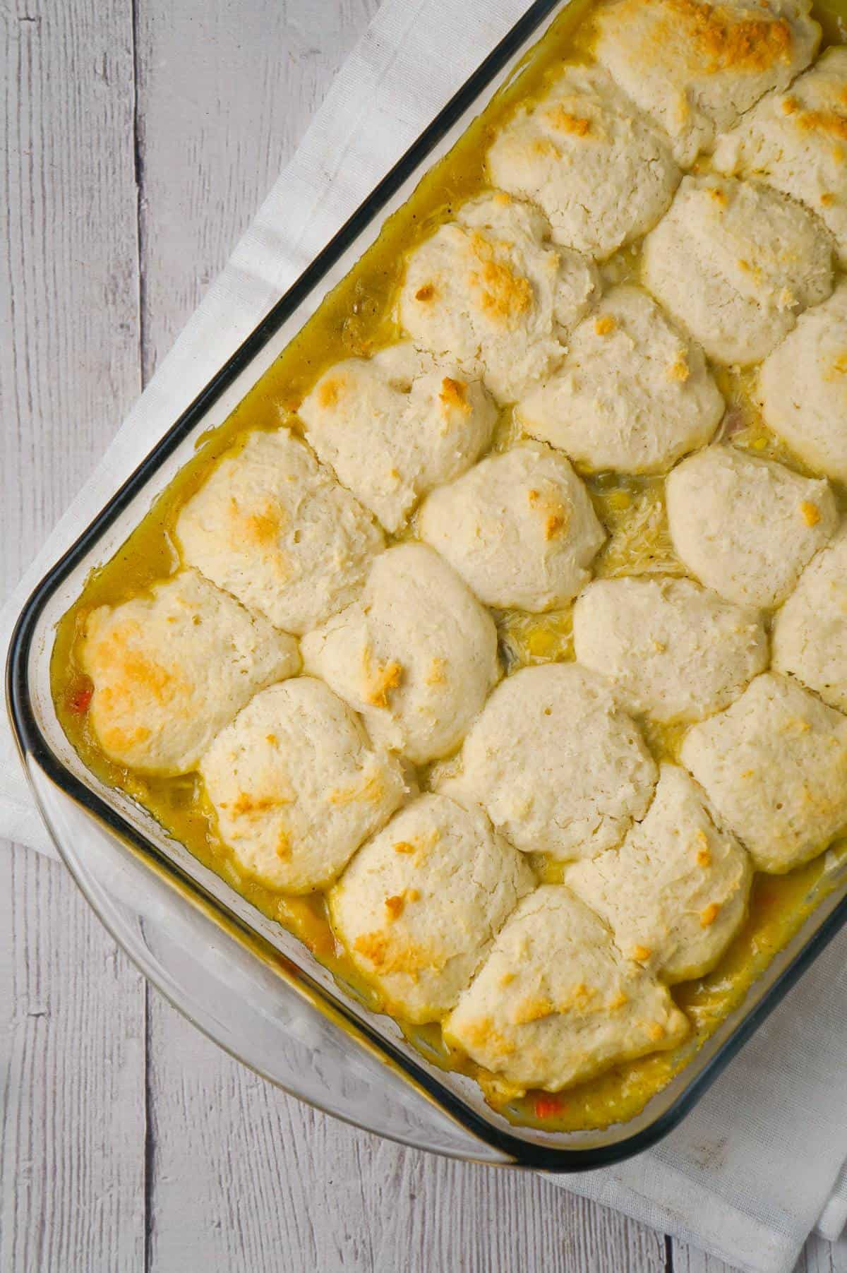 Chicken and Dumplings Casserole is an easy dinner recipe using shredded rotisserie chicken, cream of chicken soup, canned veggies and Bisquick.