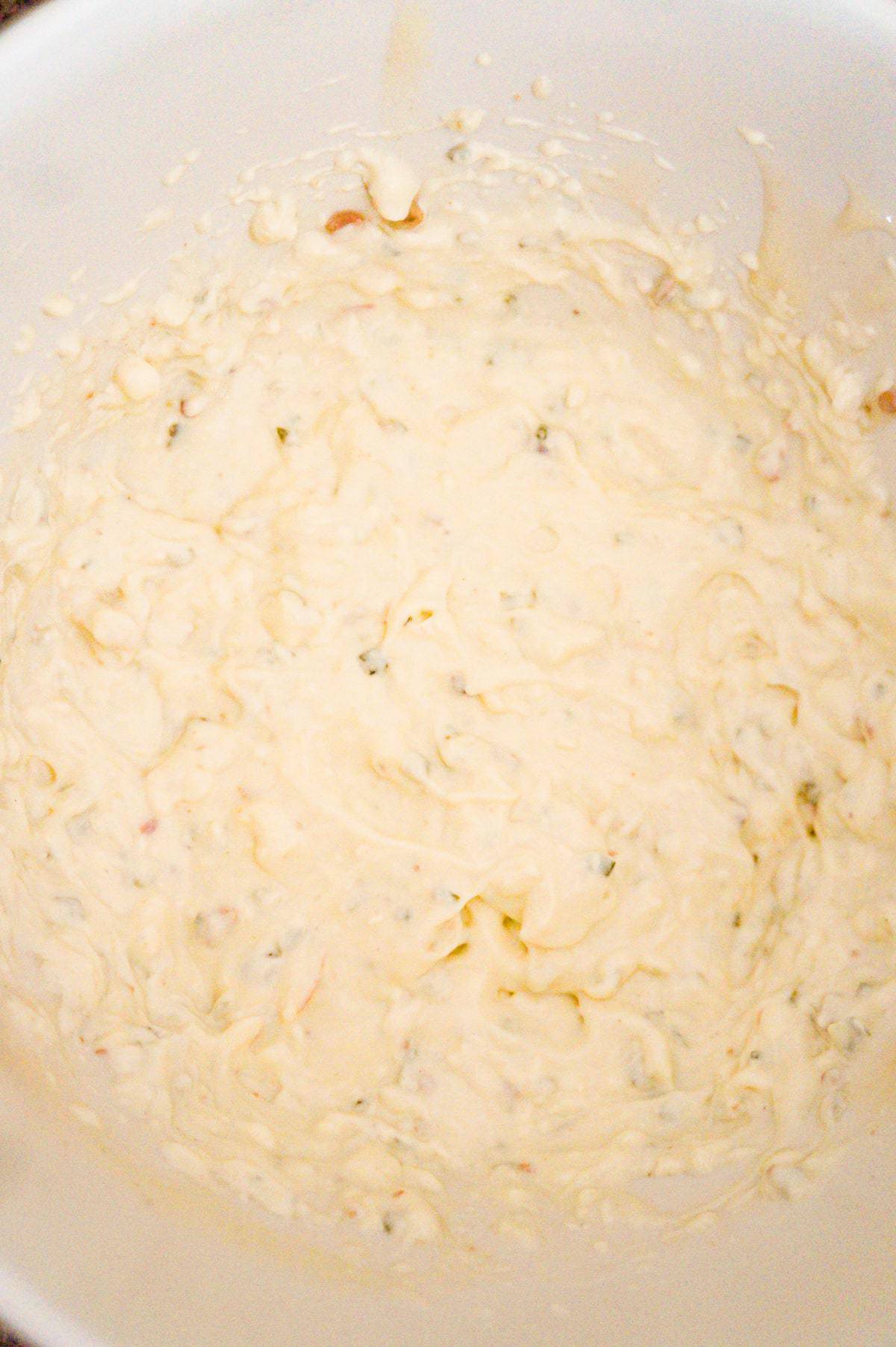 cream cheese and cream of bacon soup mixture in a mixing bowl