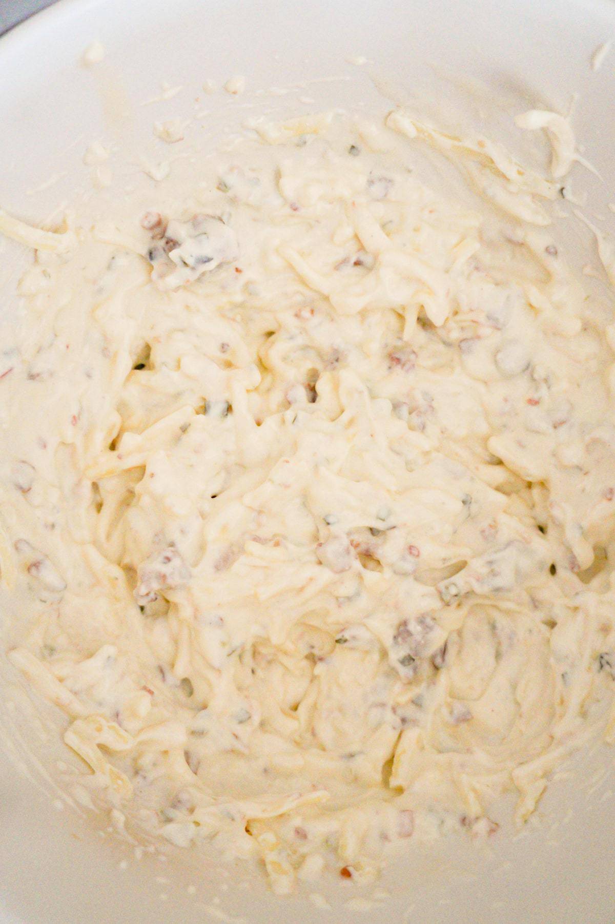 cream cheese and bacon mixture in a mixing bowl