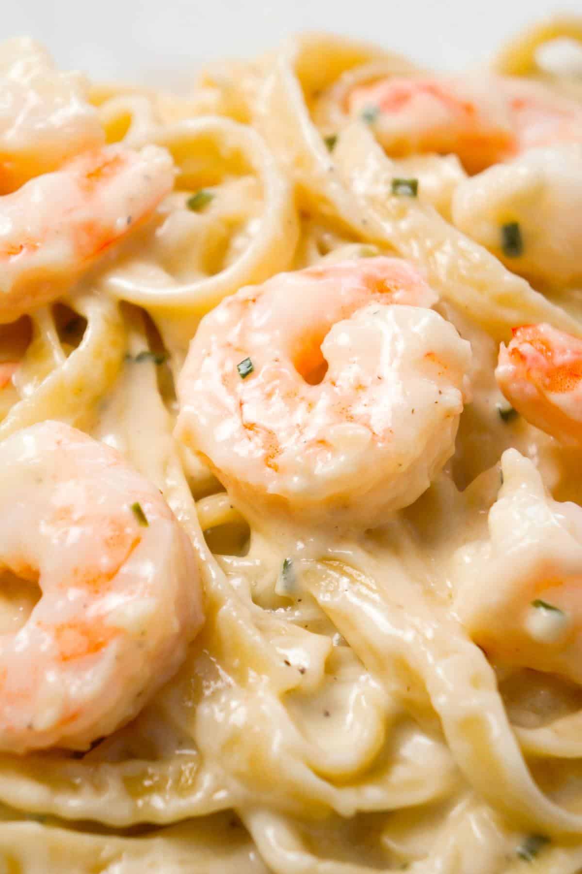 Fettuccine Alfredo with Shrimp is a delicious seafood pasta recipe with a creamy garlic parmesan sauce.