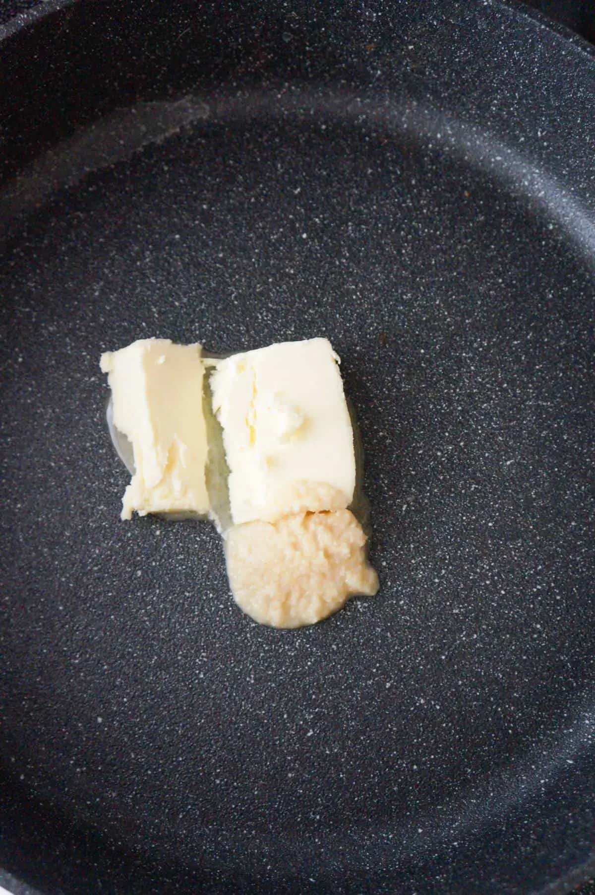 butter and garlic puree in a large pan