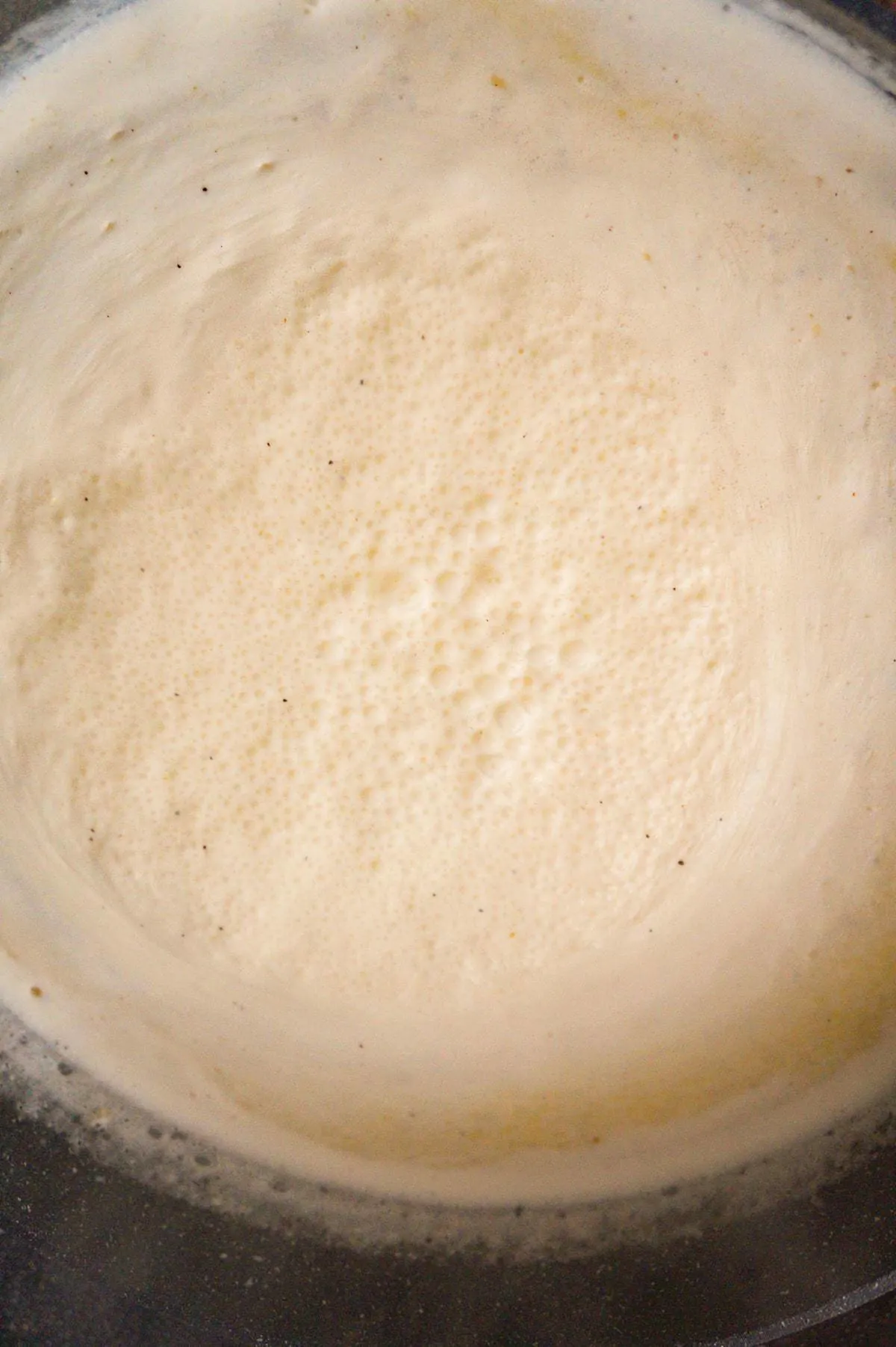 cream sauce cooking in a large pan