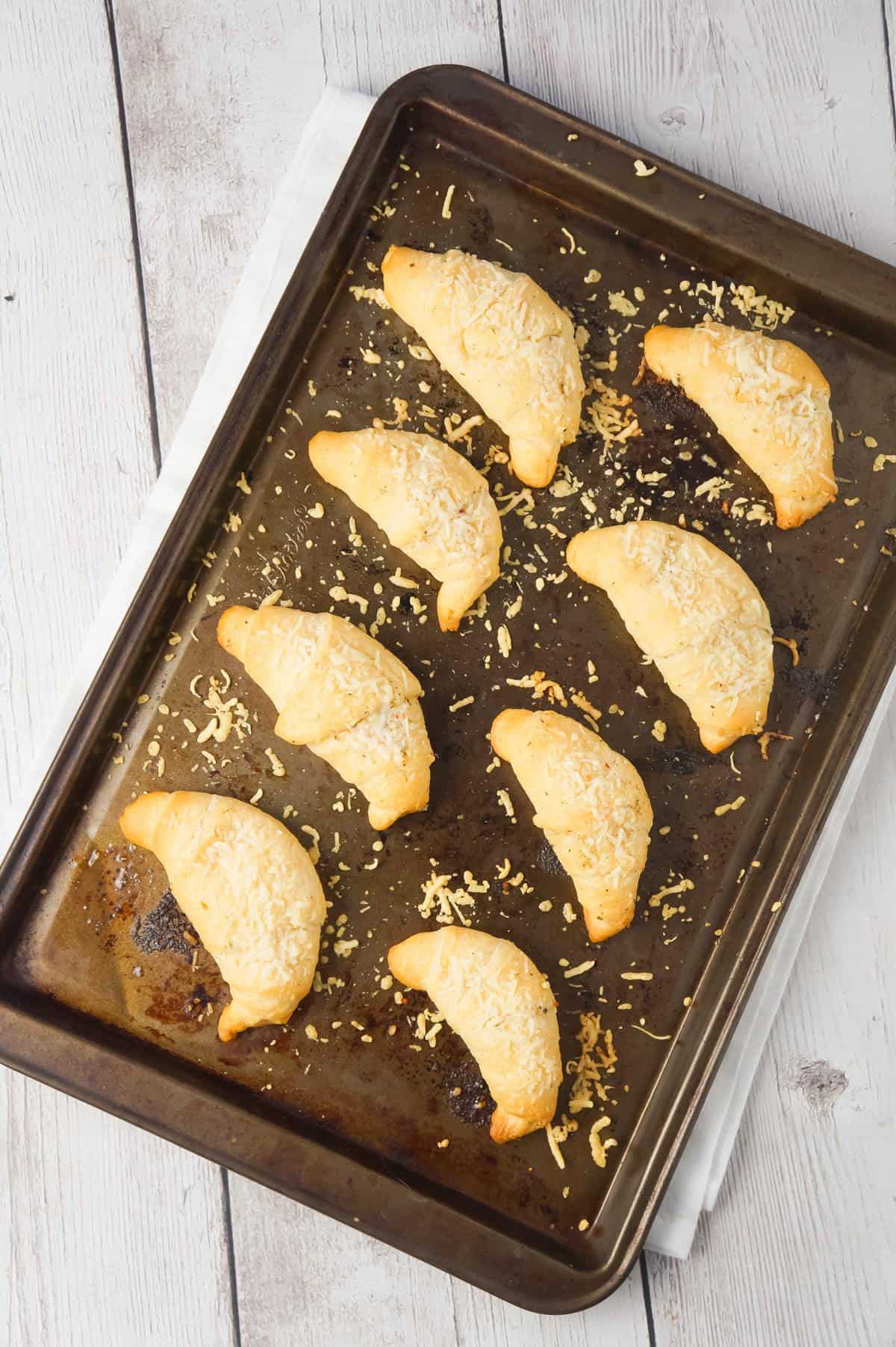 Garlic Parmesan Crescent Rolls are a simple and delicious recipe using Pillsbury crescent rolls, homemade garlic butter and shredded Parmesan cheese.