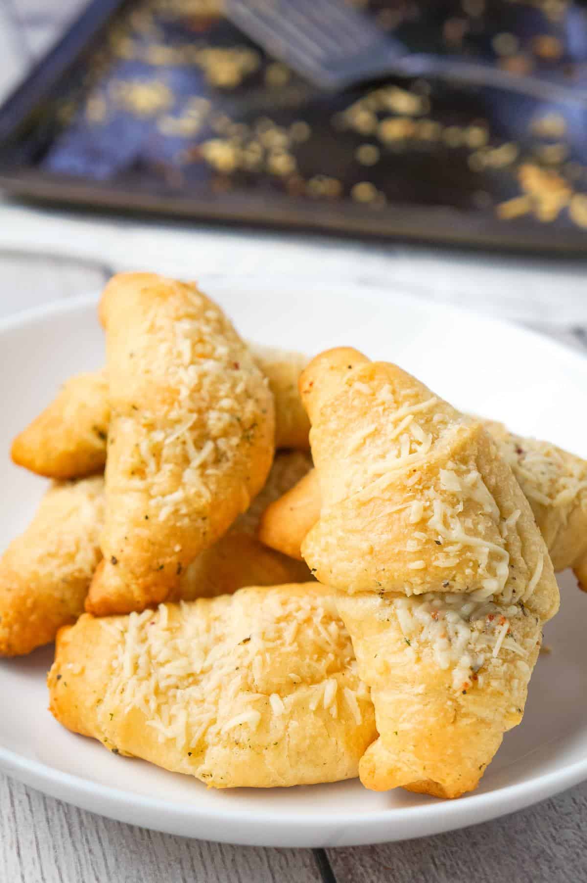 Garlic Parmesan Crescent Rolls are a simple and delicious recipe using Pillsbury crescent rolls, homemade garlic butter and shredded Parmesan cheese.