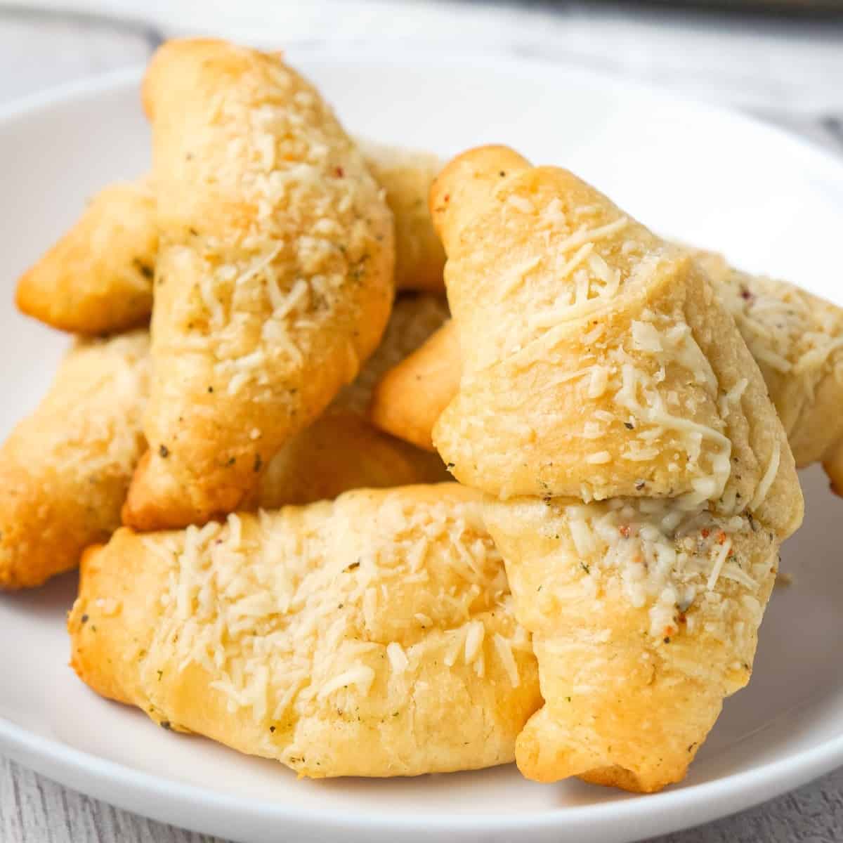 Garlic Parmesan Crescent Rolls are a simple and delicious recipe using Pillsbury crescent rolls, homemade garlic butter and shredded Parmesan cheese.