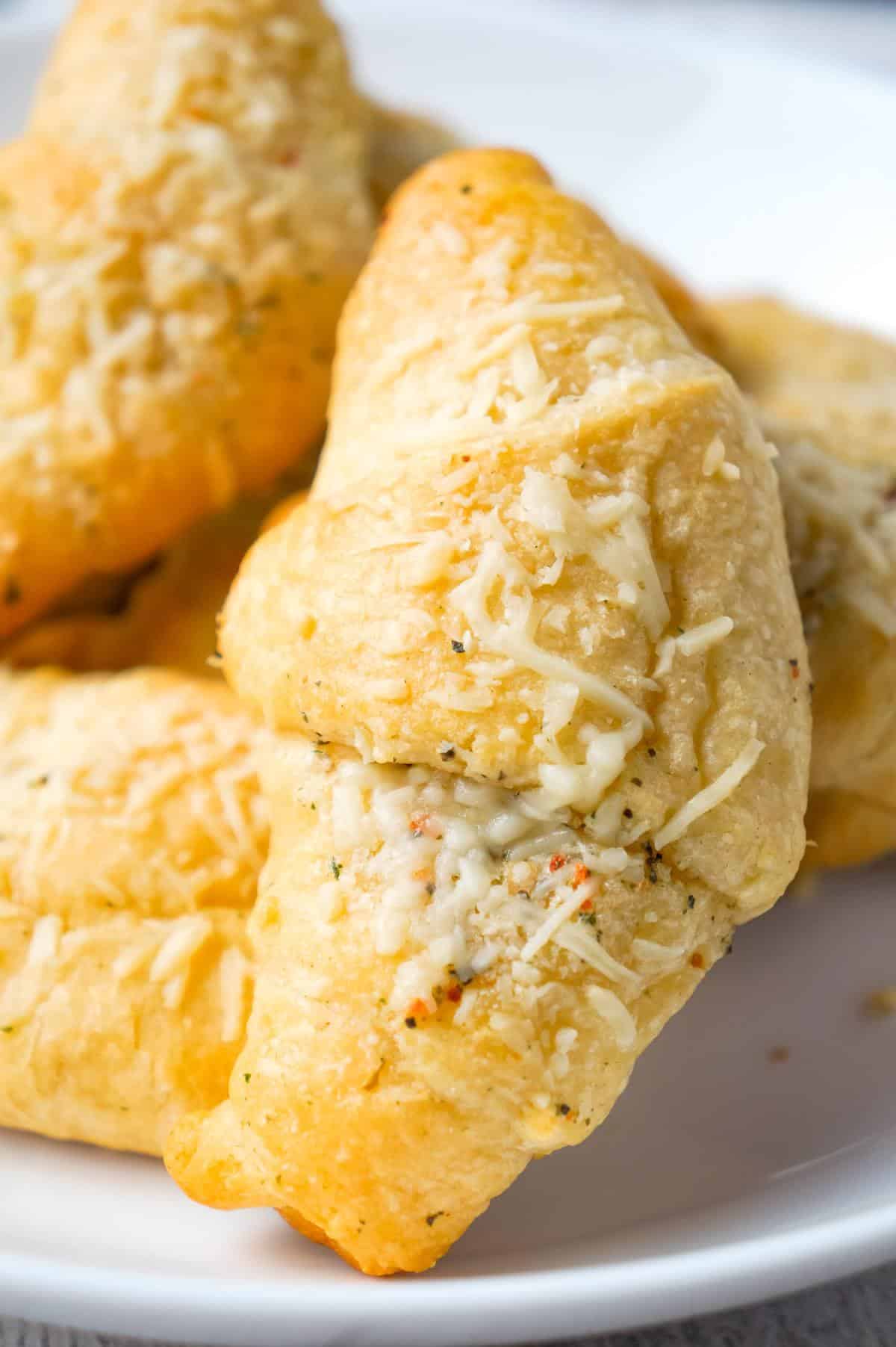 Garlic Parmesan Crescent Rolls are a simple and delicious recipe using Pillsbury crescent rolls, homemade garlic butter and shredded Parmesan cheese.