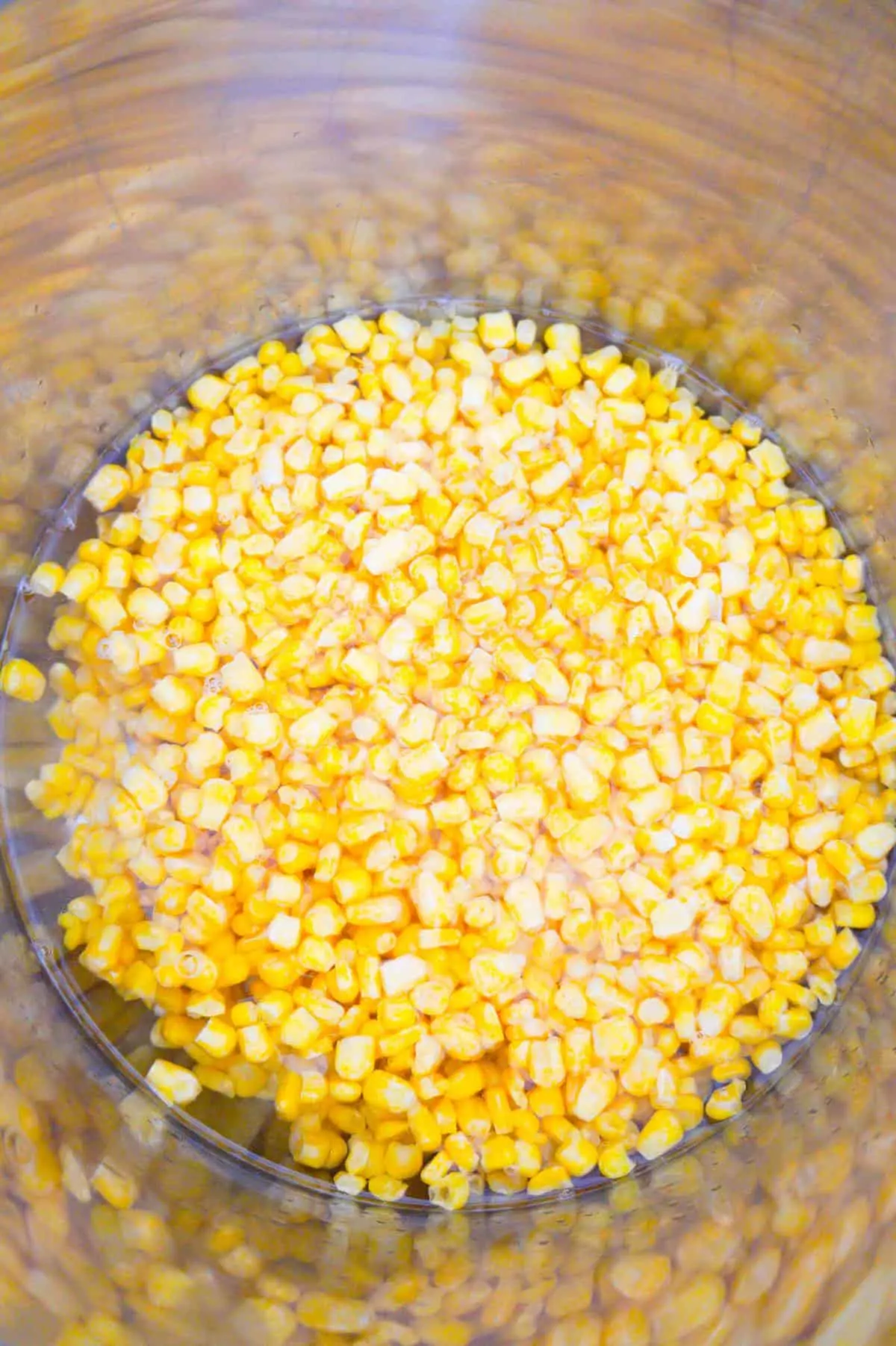 water and frozen corn in an Instant Pot