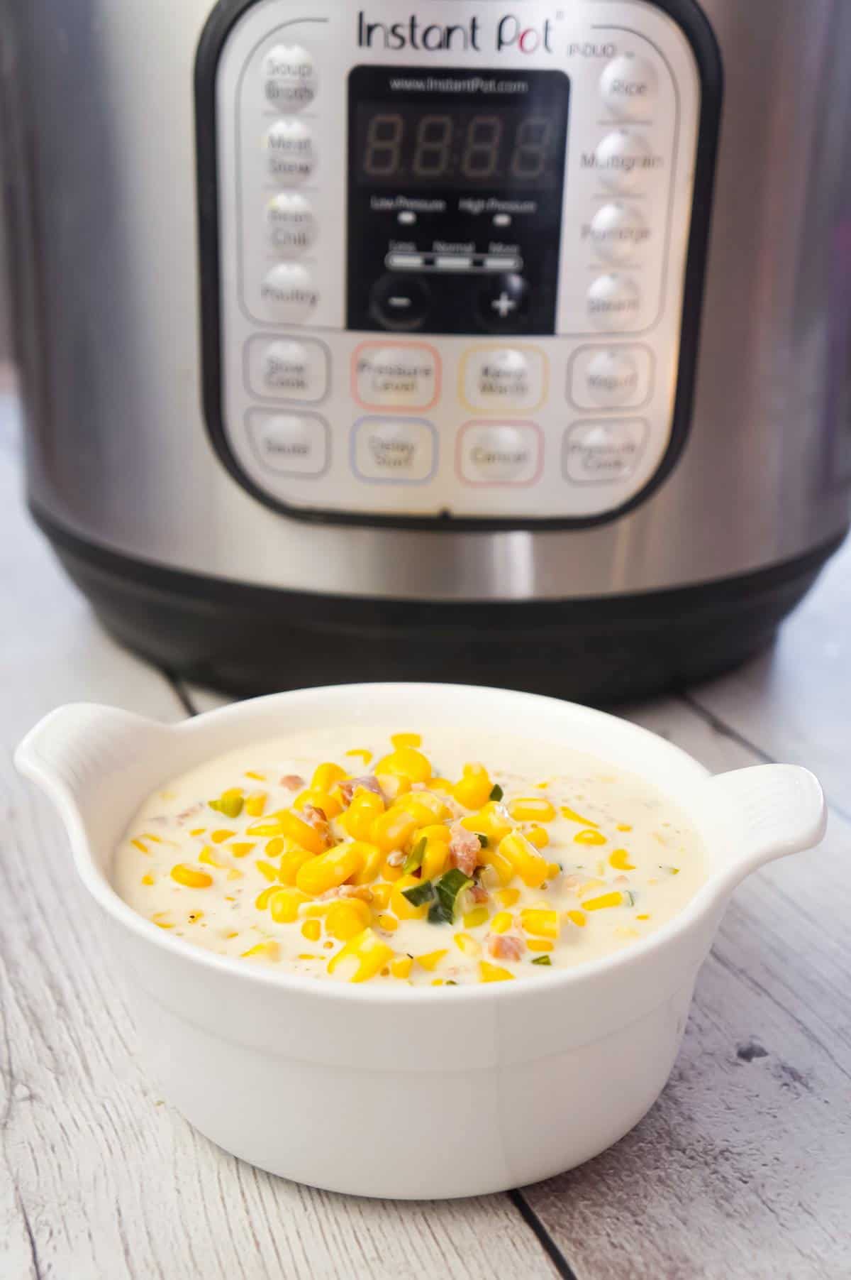 Instant Pot Corn Chowder with Cream Cheese and Bacon is a hearty soup recipe loaded with corn, crumbled bacon, Philadelphia whipped chive cream cheese and chopped green onions.