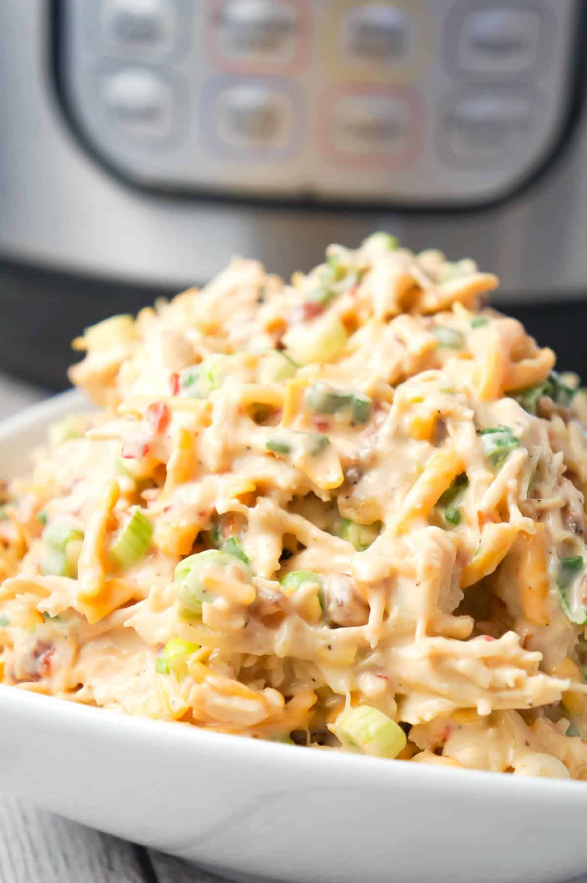 Instant Pot Sweet Chili Bacon Chicken Salad Sandwiches are easy lunch or weeknight dinner recipe using boneless, skinless chicken breasts cooked in the Instant Pot and then tossed with mayo, Thai sweet chili sauce, green onions, crumbled bacon and cheese.