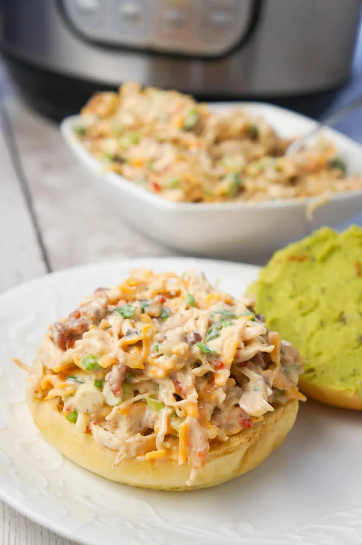Instant Pot Sweet Chili Bacon Chicken Salad Sandwiches are easy lunch or weeknight dinner recipe using boneless, skinless chicken breasts cooked in the Instant Pot and then tossed with mayo, Thai sweet chili sauce, green onions, crumbled bacon and cheese.
