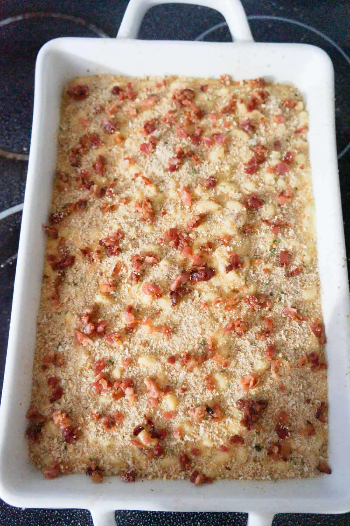 crumbled bacon and bread crumbs on top of mac and cheese before baking