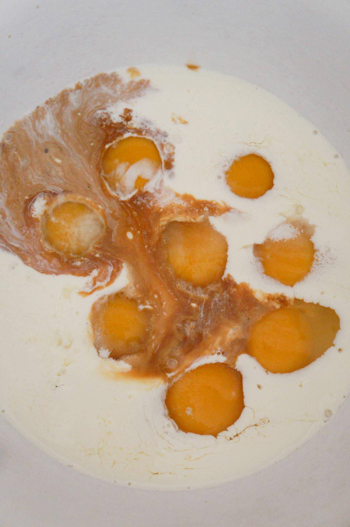eggs, heavy cream and vanilla in a mixing bowl