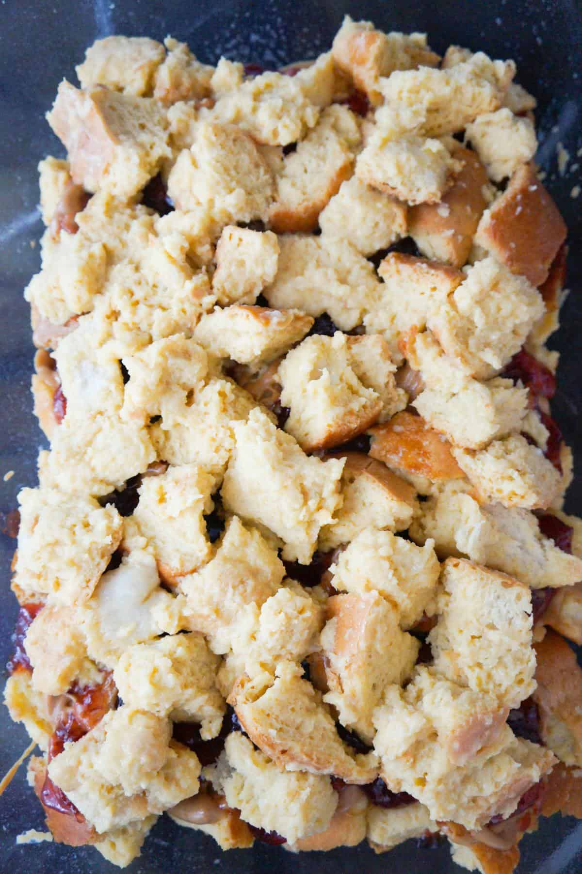 cubed bread and egg mixture in a baking dish