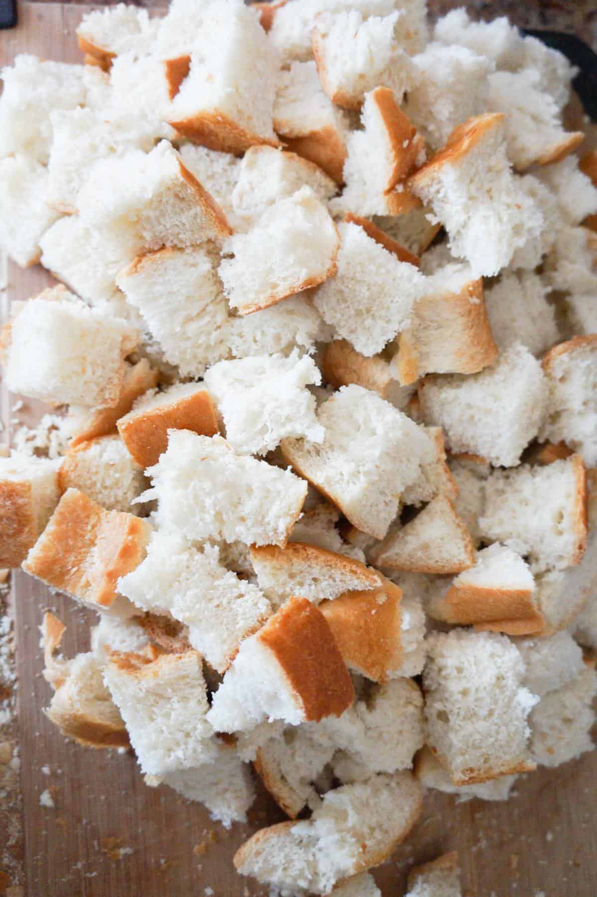 cubed bread on a cutting board