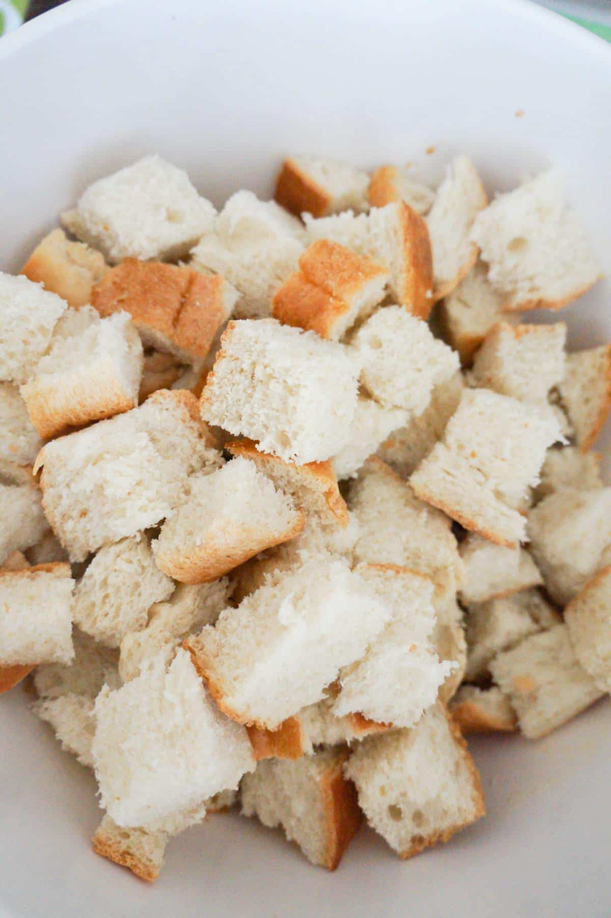 cubed bread in a mixing bowl
