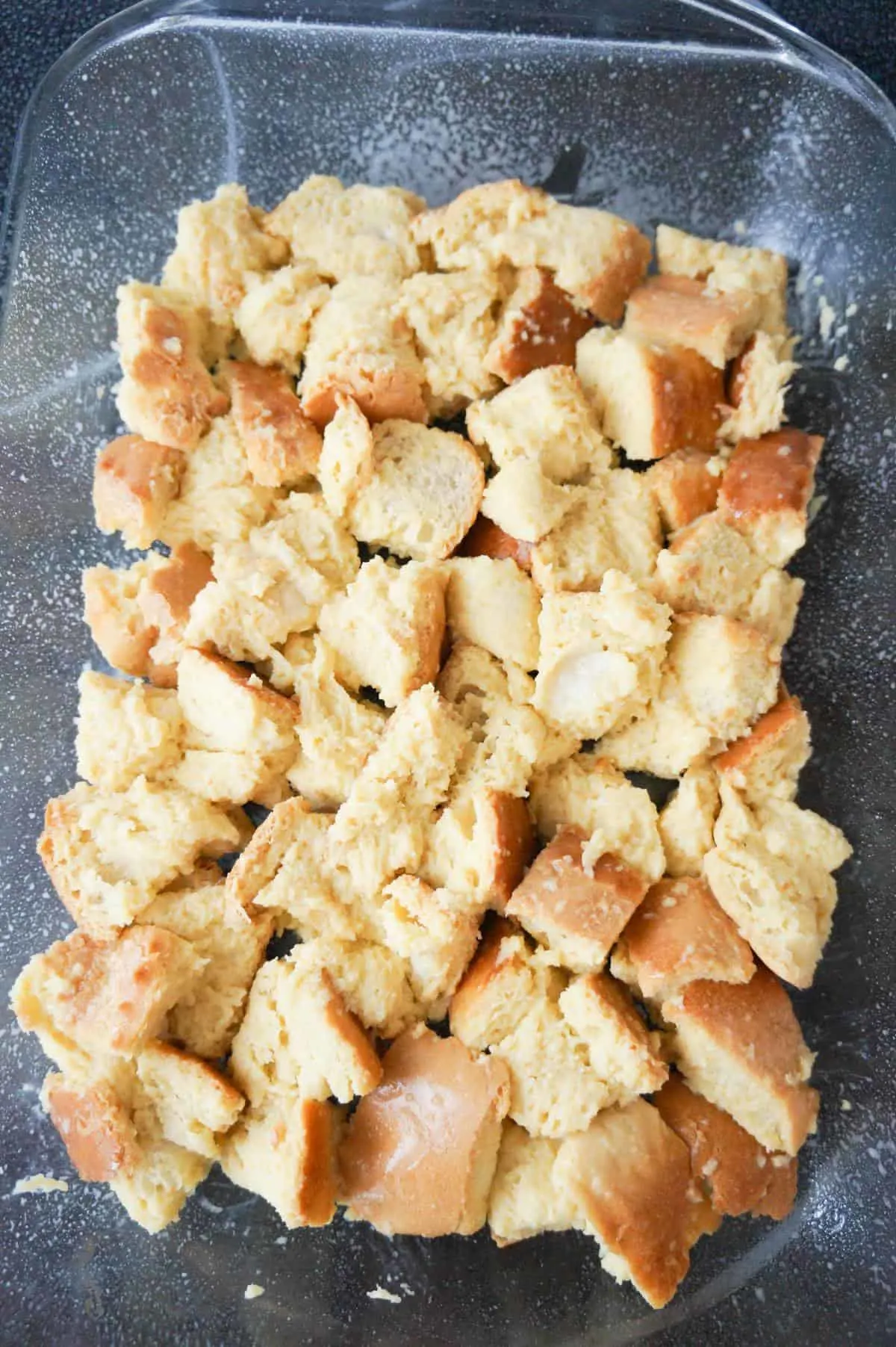 cubed bread in a baking dish