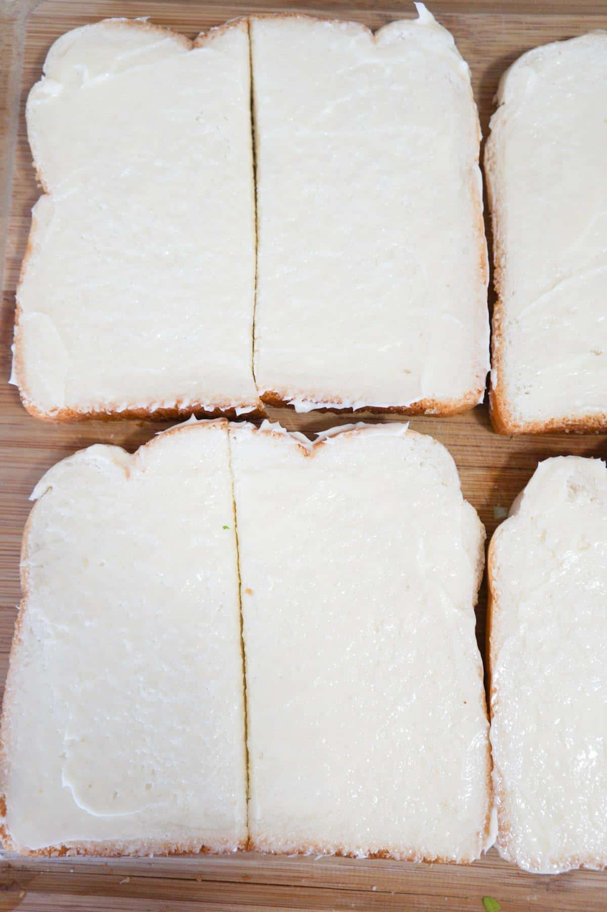 bread slices on a cutting board cut in half