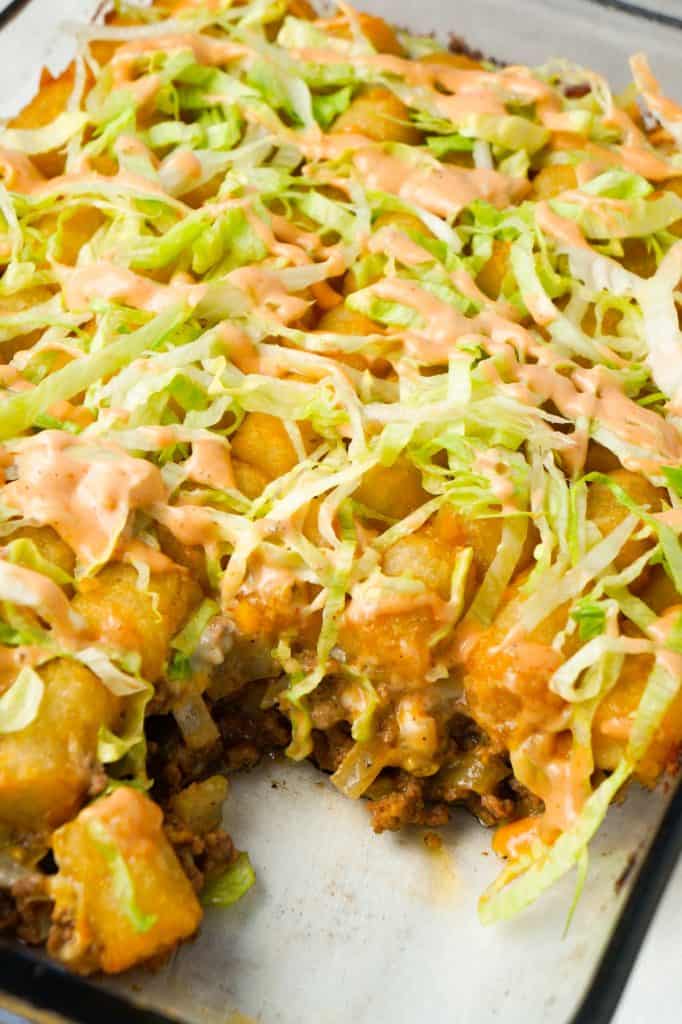 Big Mac Tater Tot Casserole is an easy dinner recipe that starts out with a base of ground beef, onions and dill pickles, all tossed in a copycat Big Mac sauce, and then topped with cheddar cheese and tater tots.