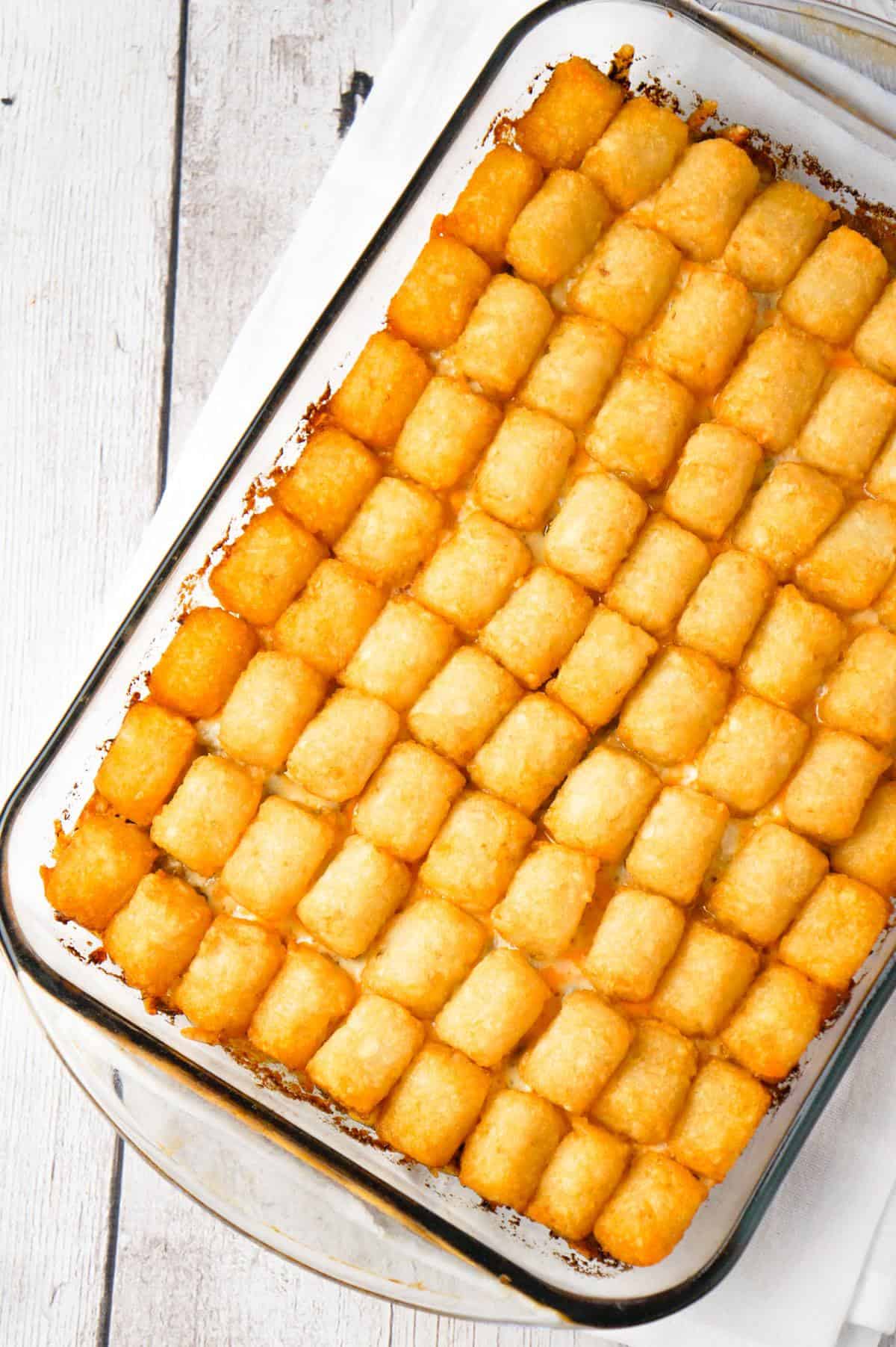 Big Mac Tater Tot Casserole is an easy dinner recipe that starts out with a base of ground beef, onions and dill pickles, all tossed in a copycat Big Mac sauce, and then topped with cheddar cheese and tater tots.