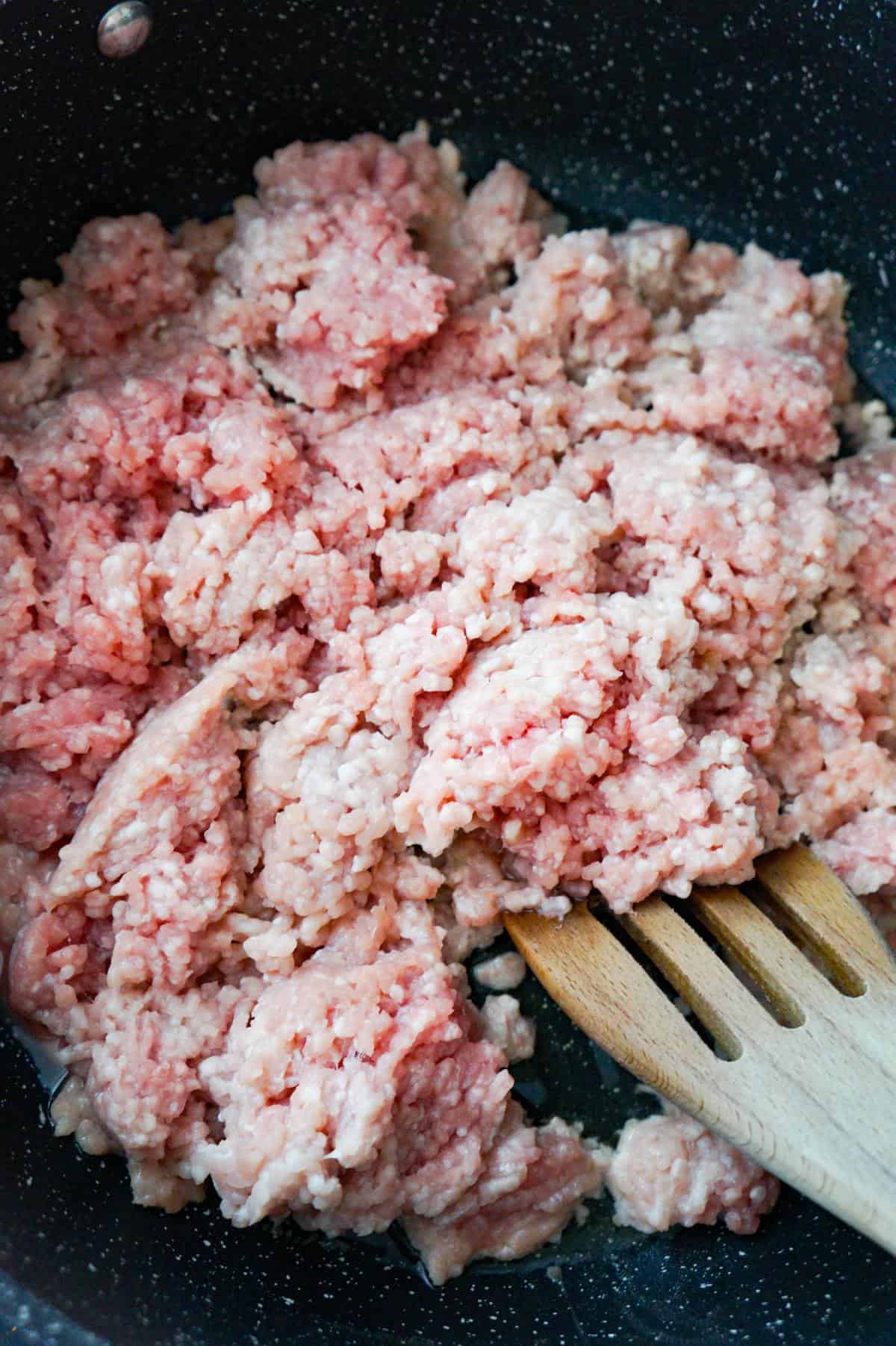 ground pork cooking in a saute pan