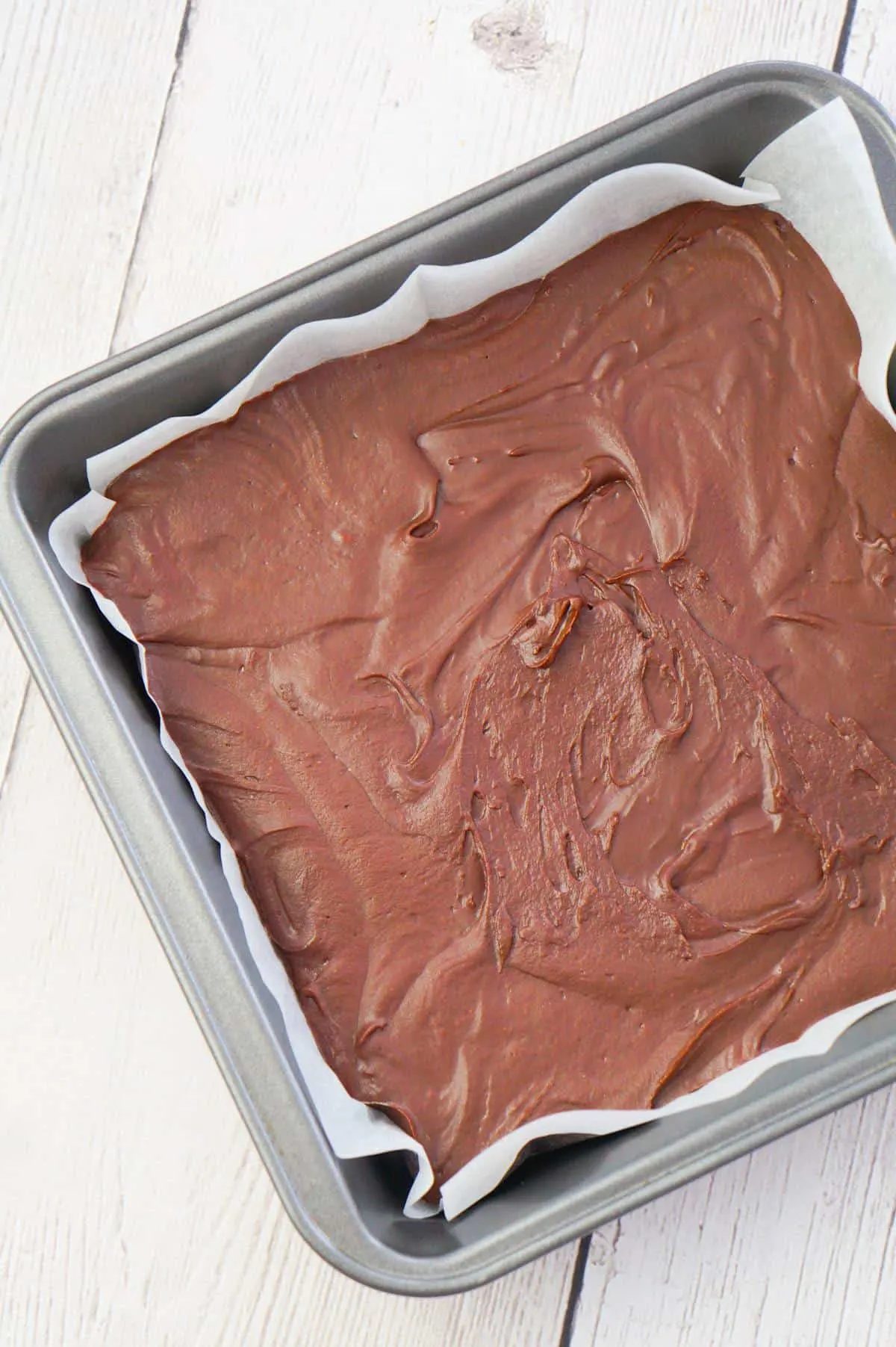 Easy Chocolate Fudge is a simple microwave fudge recipe using semi-sweet chocolate chips and chocolate frosting.