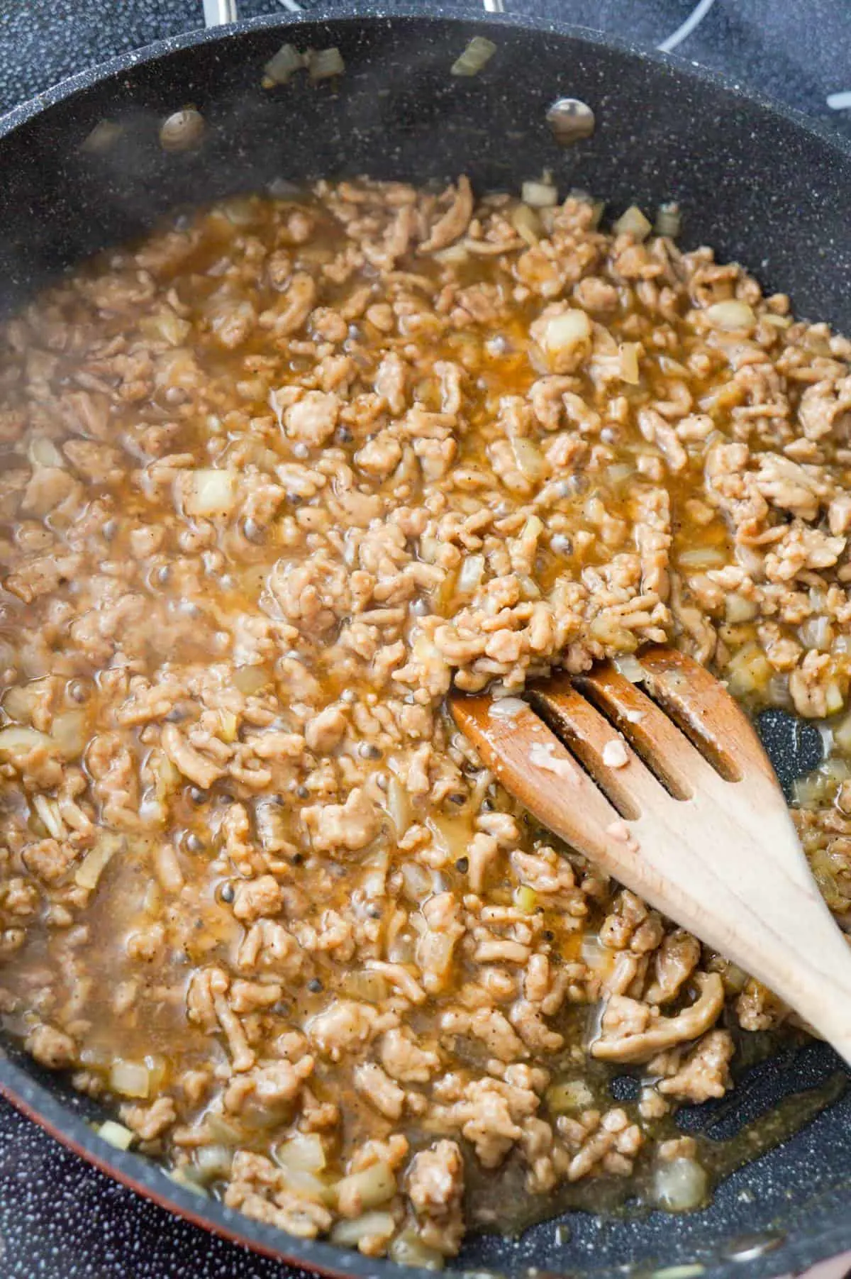 ground chicken and honey garlic sauce mixture in a saute pan