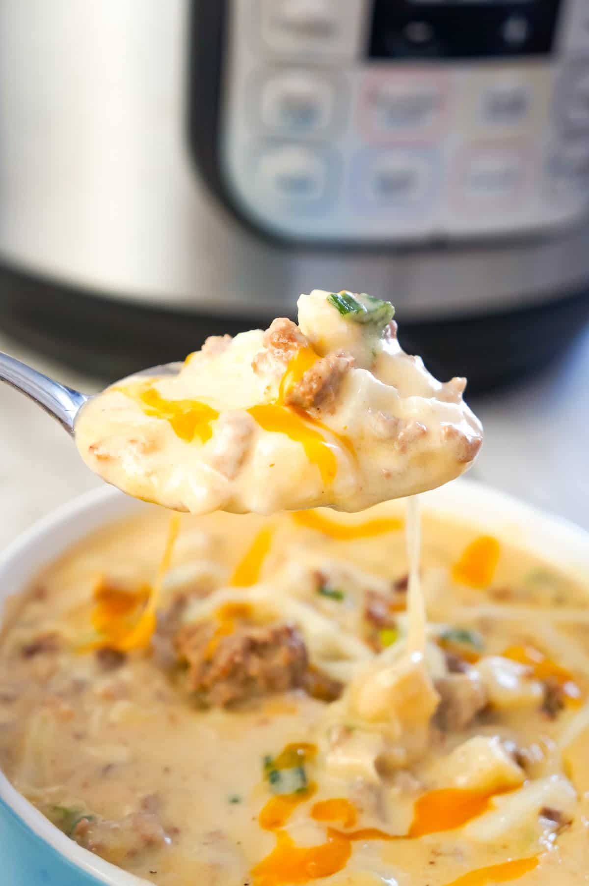 Instant Pot Bacon Cheeseburger Soup with Potatoes is a hearty pressure cooker soup recipe loaded with ground beef, crumbled bacon, diced hash brown potatoes, chopped green onions and cheddar cheese.