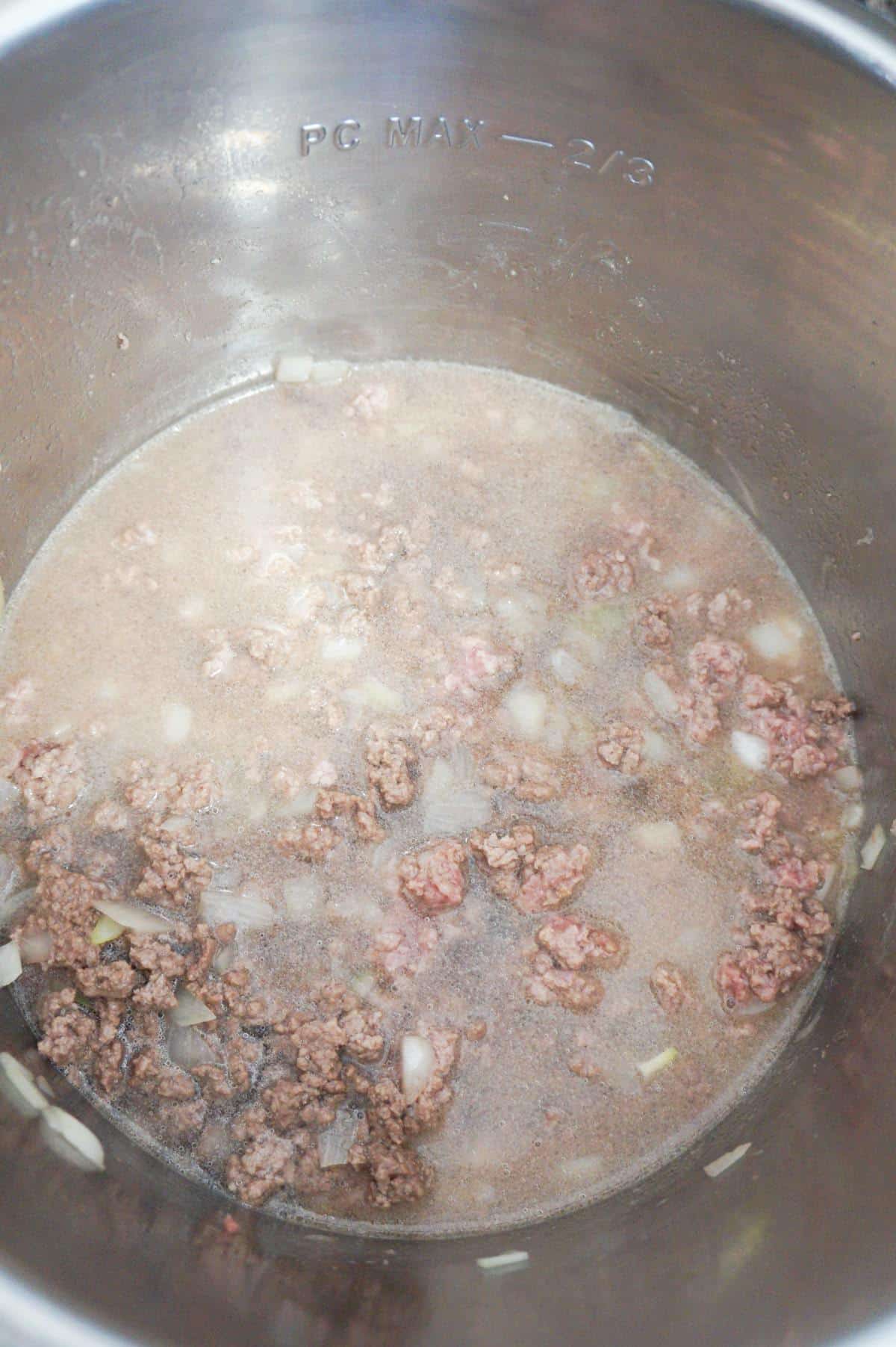 ground beef and water in an Instant Pot