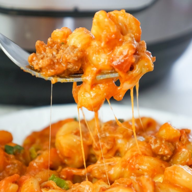 Instant Pot Cheesy Taco Pasta is a delicious pressure cooker pasta recipe loaded with ground beef, salsa, chili sauce, taco seasoning, chopped green onions and shredded cheese.