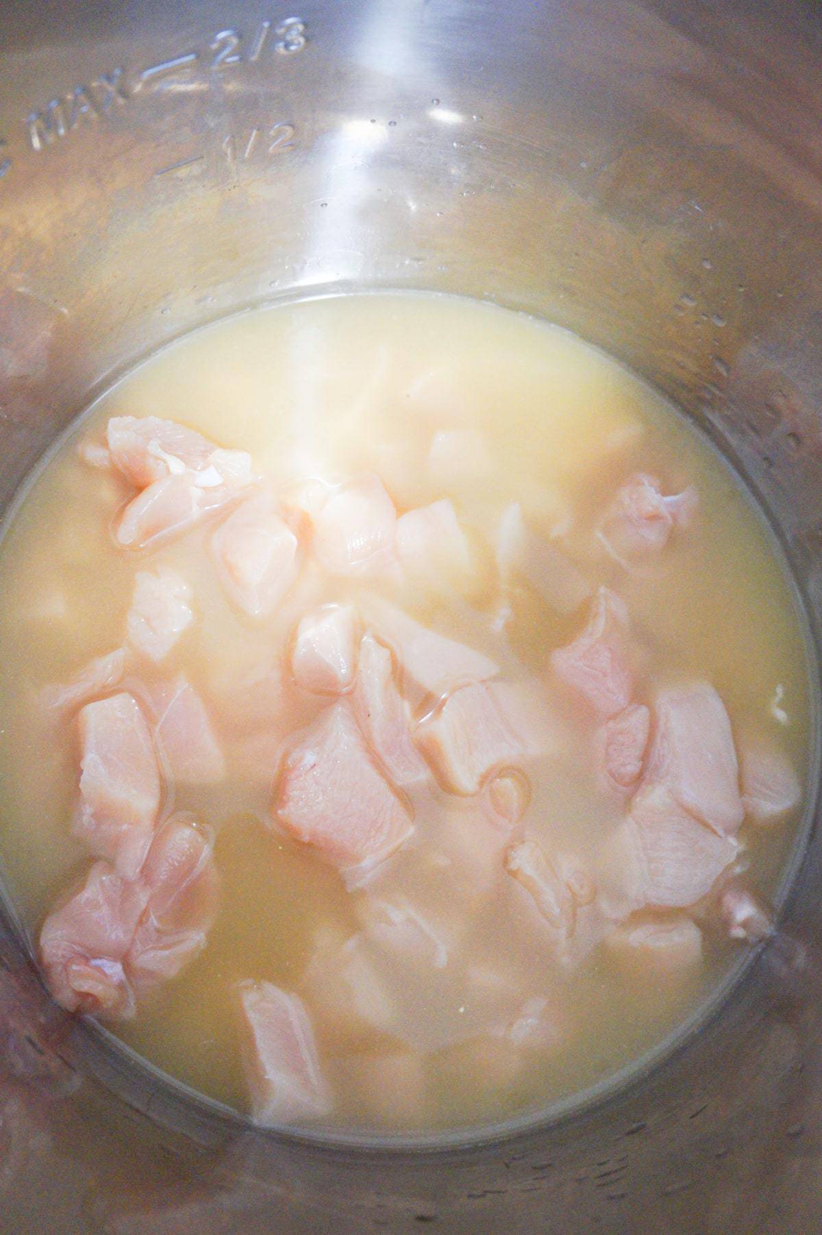 chicken breast chunks in chicken broth in an Instant Pot